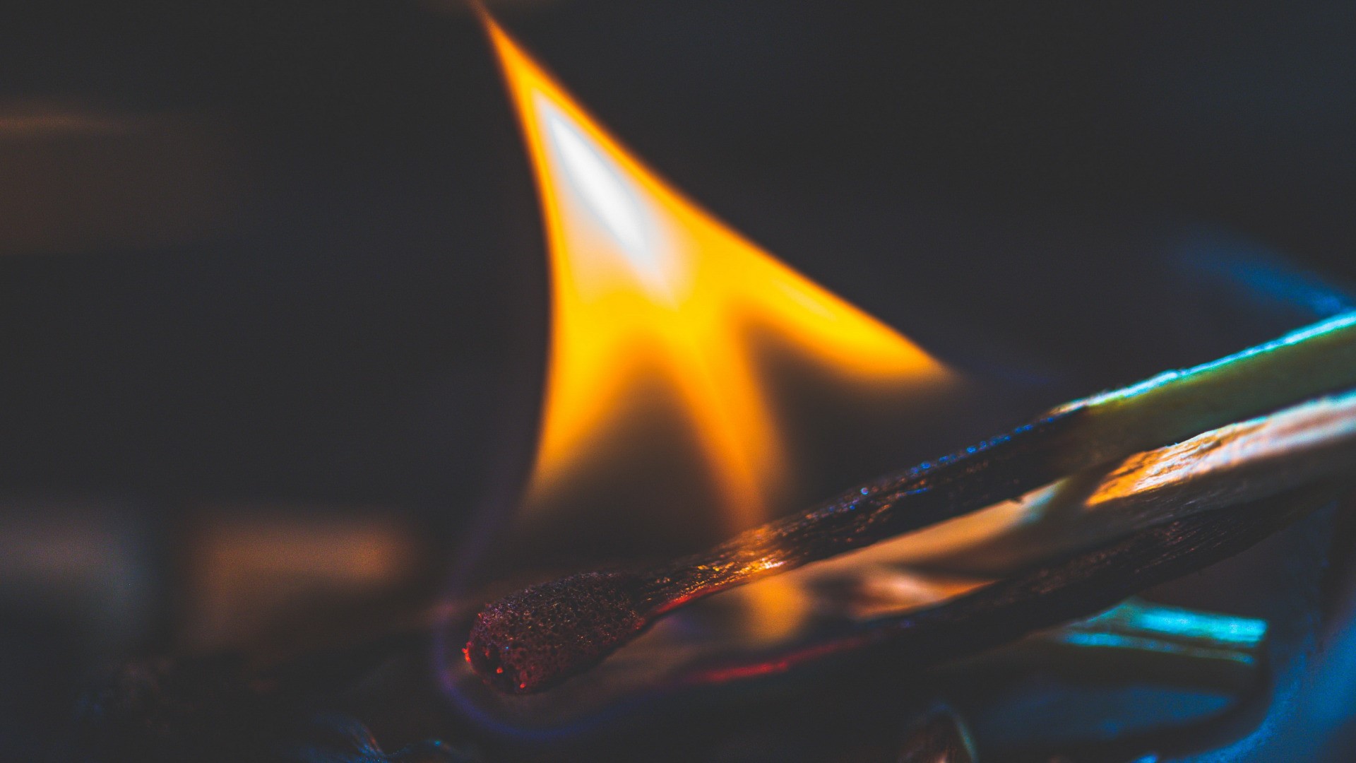 Close-up of burning matches with vibrant flames HD Wallpaper