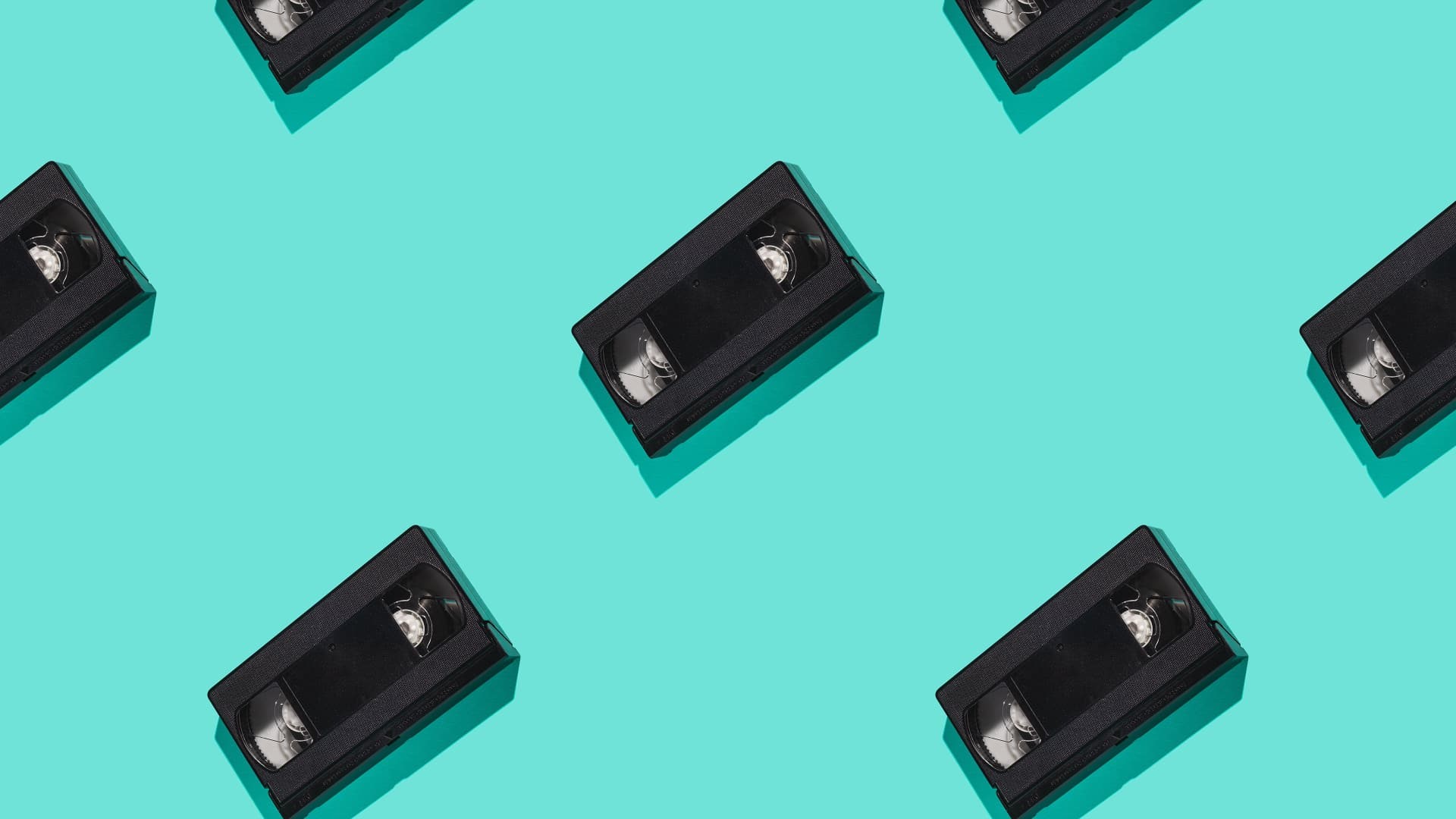 Pattern of black VHS tapes on a cyan background HD Wallpaper