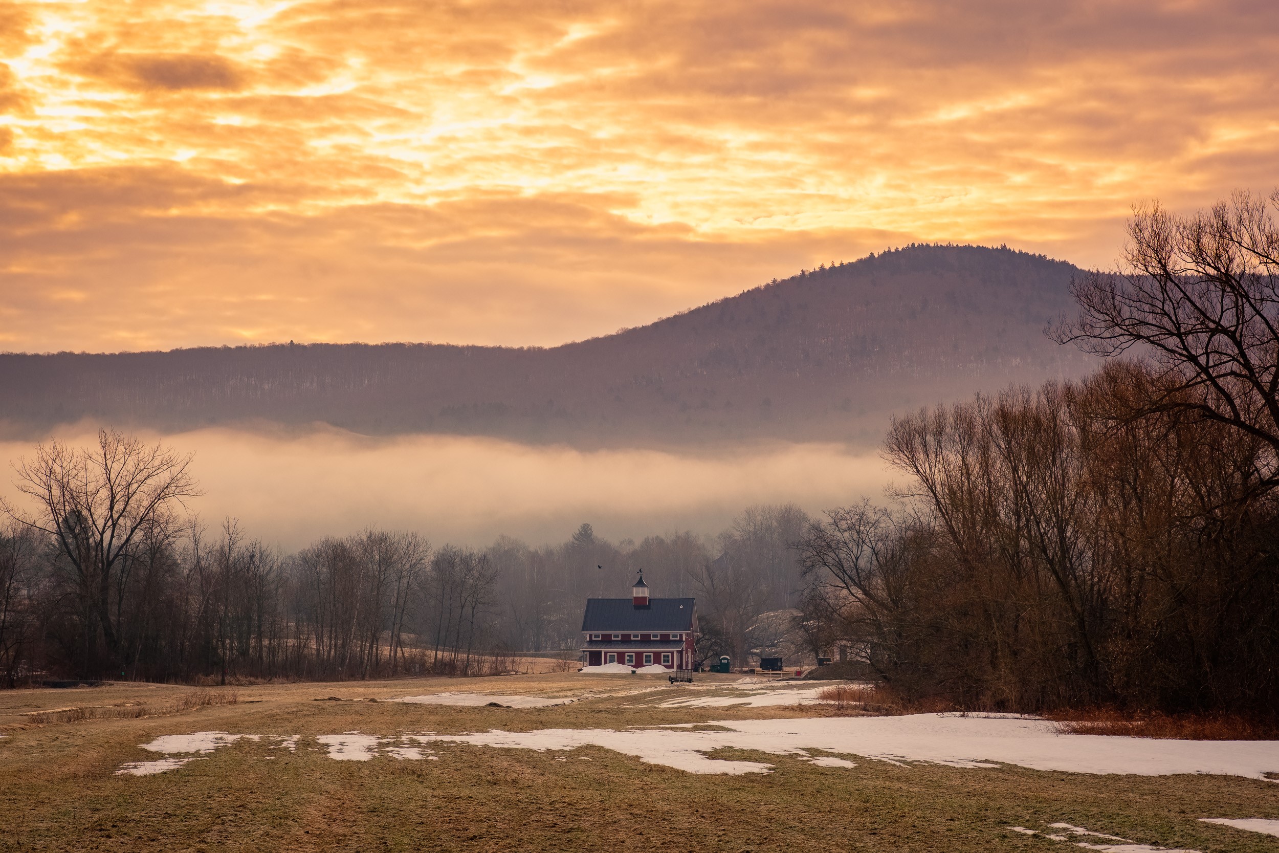 Red barn in misty valley at sunset HD Wallpaper