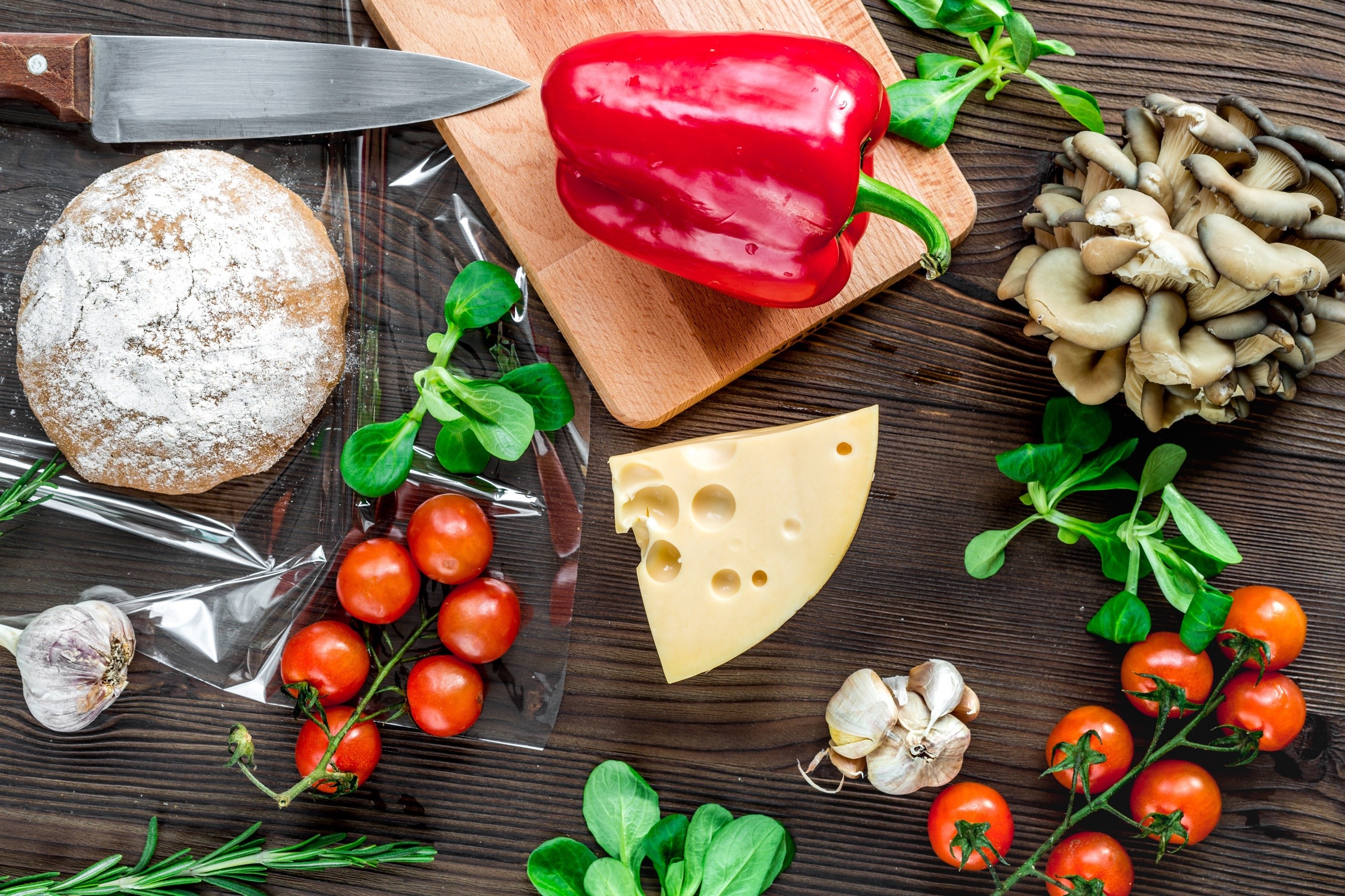 Ingredients for a meal with bread, cheese, and vegetables HD Wallpaper