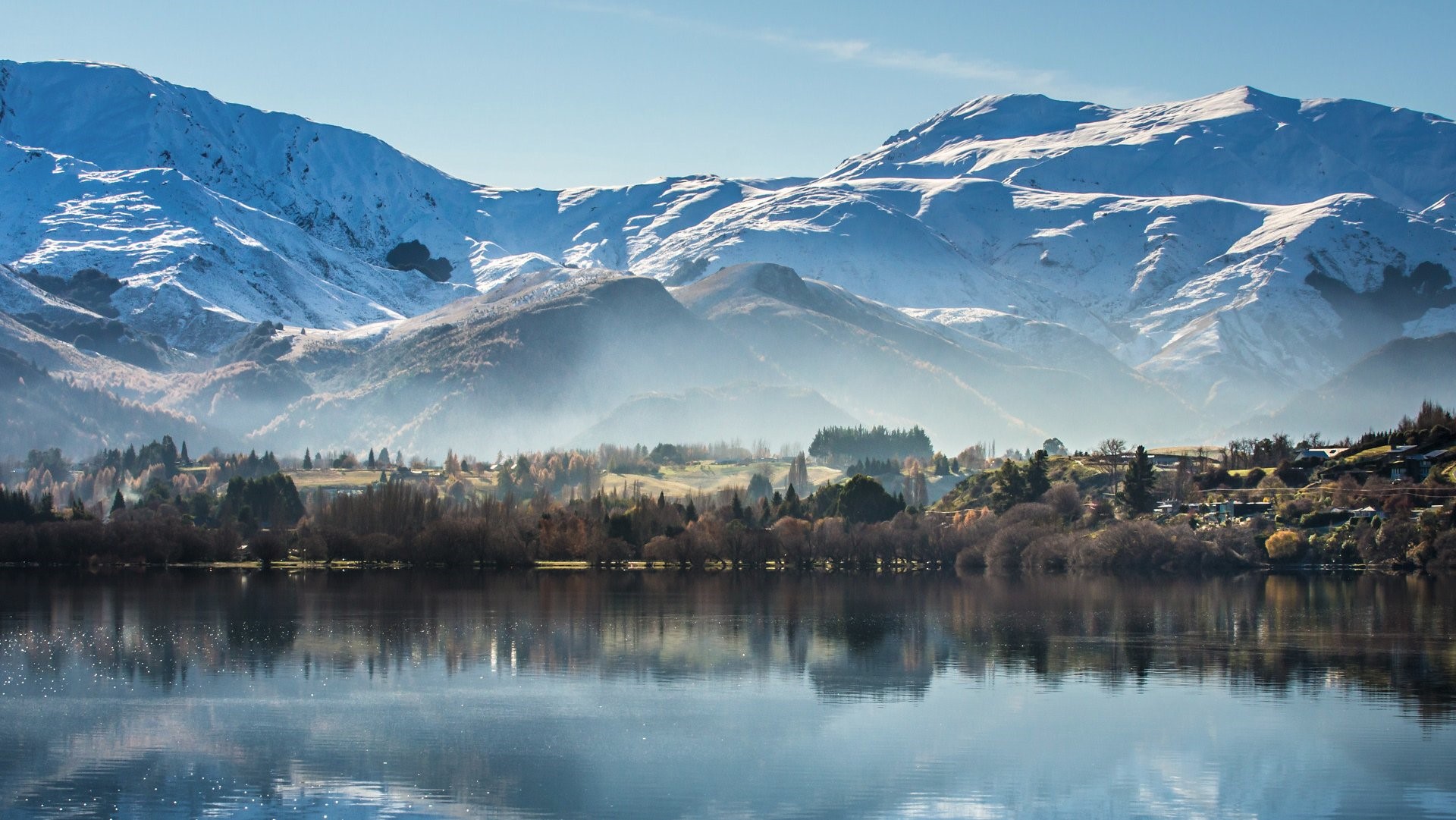 Snow-capped mountains reflected in a lake HD Wallpaper