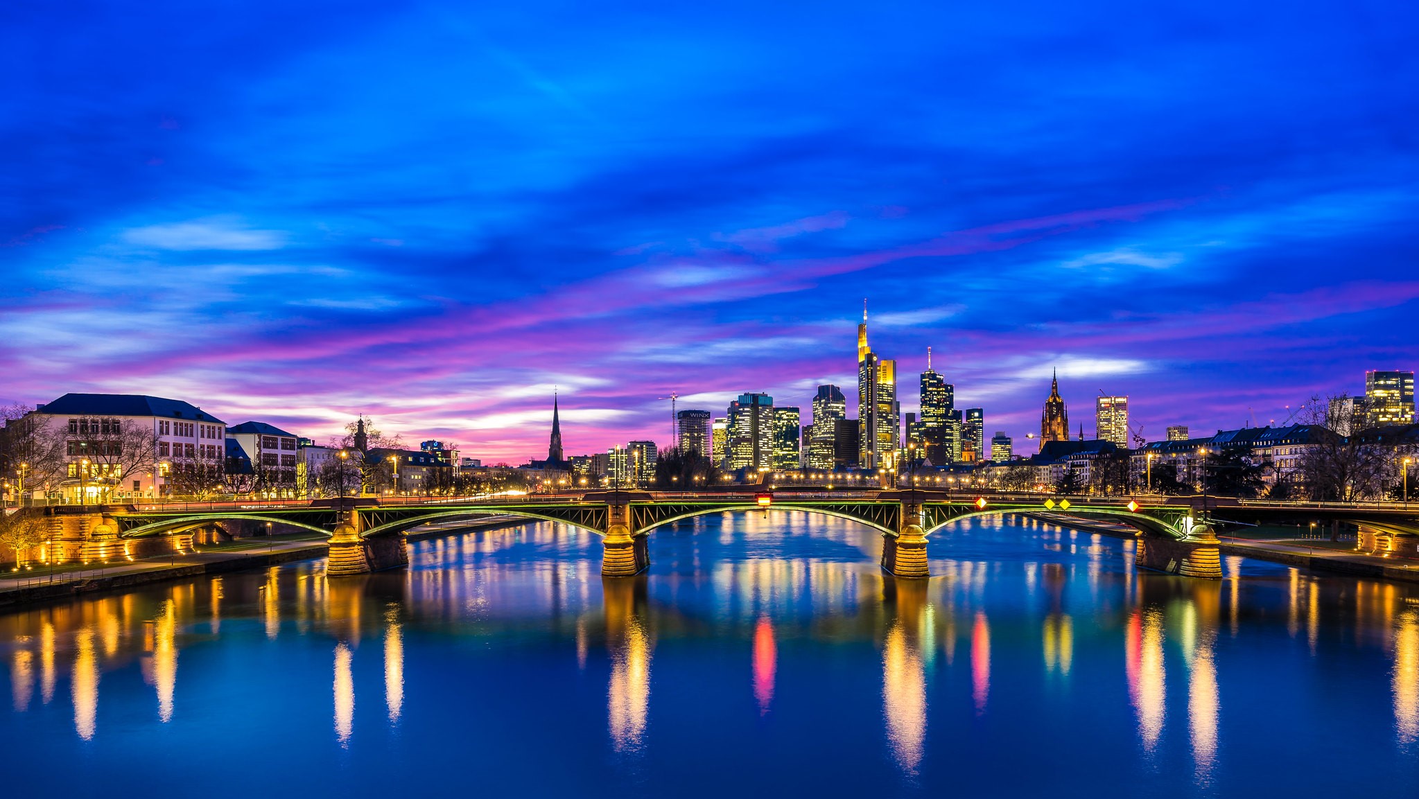 Frankfurt cityscape with river and bridges at sunset HD Wallpaper
