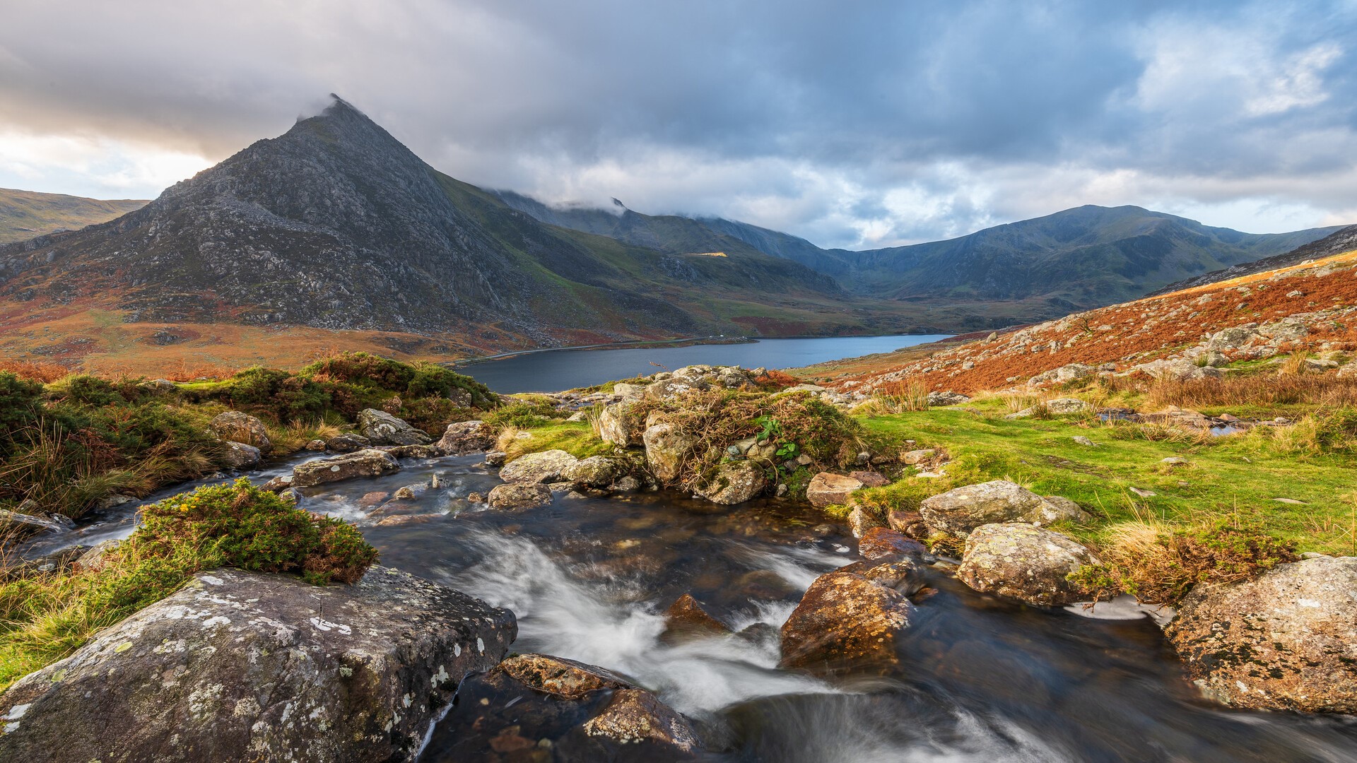 Mountain lake with stream and rocky foreground HD Wallpaper