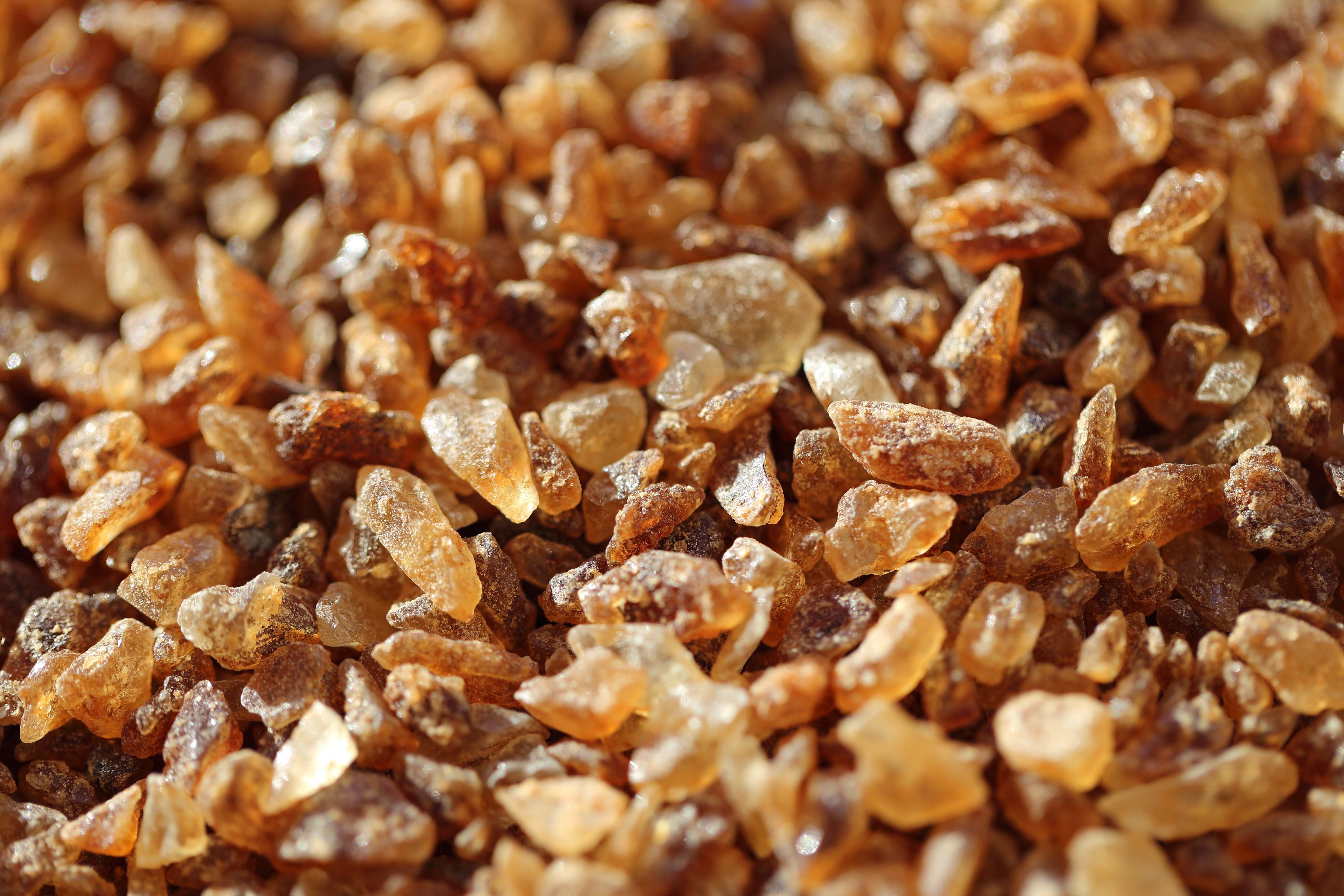Brown sugar crystals, close-up HD Wallpaper