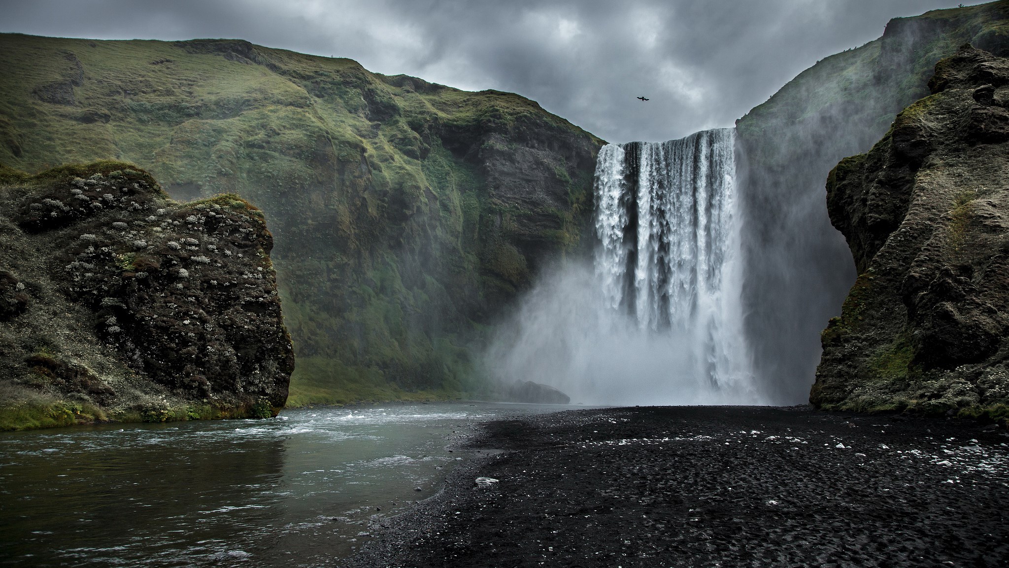 Skogafoss waterfall in Iceland with a helicopter HD Wallpaper