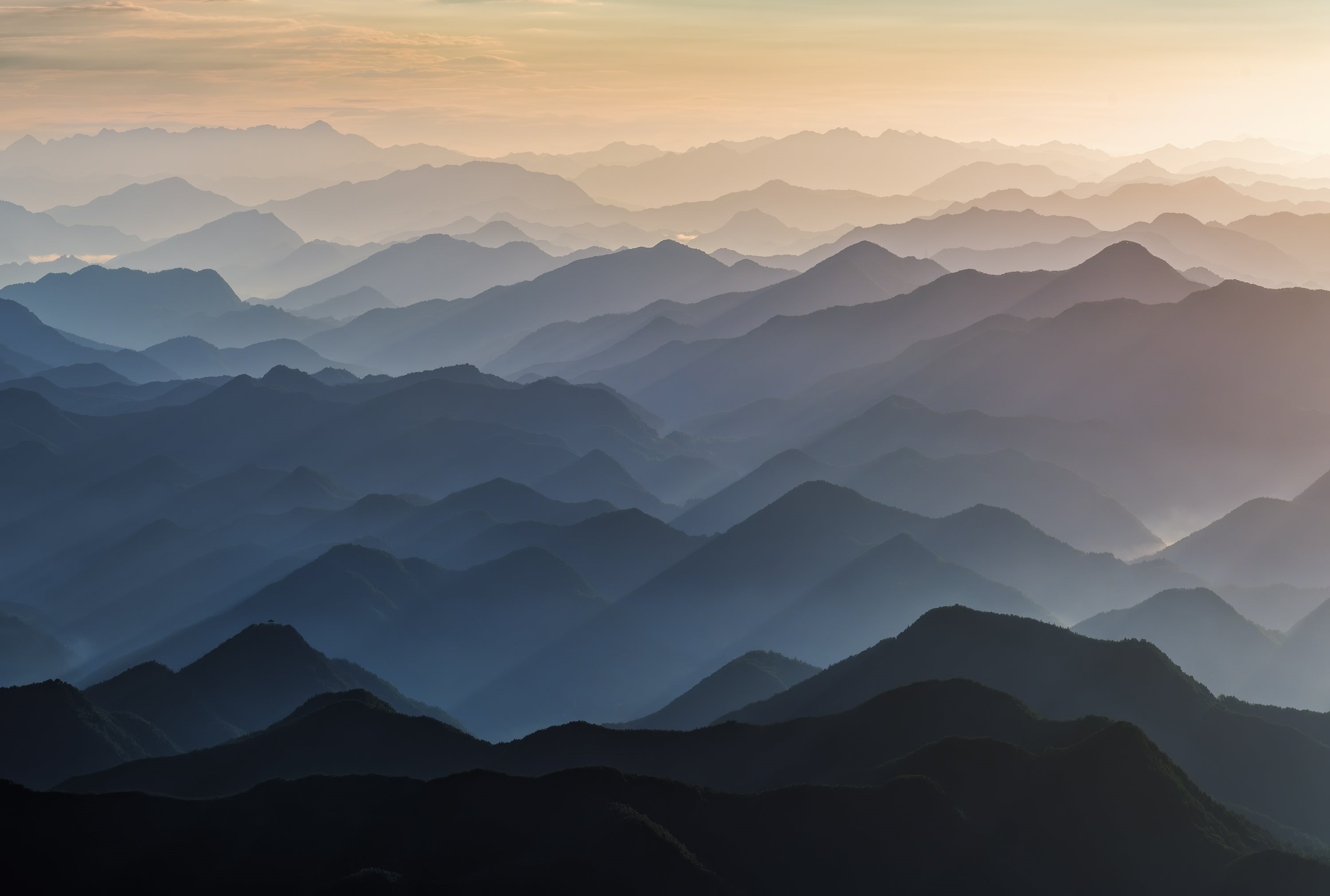 Layered mountains in the morning mist HD Wallpaper