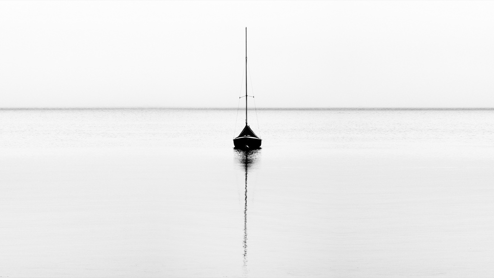 Minimalist sailboat on calm water with horizon HD Wallpaper