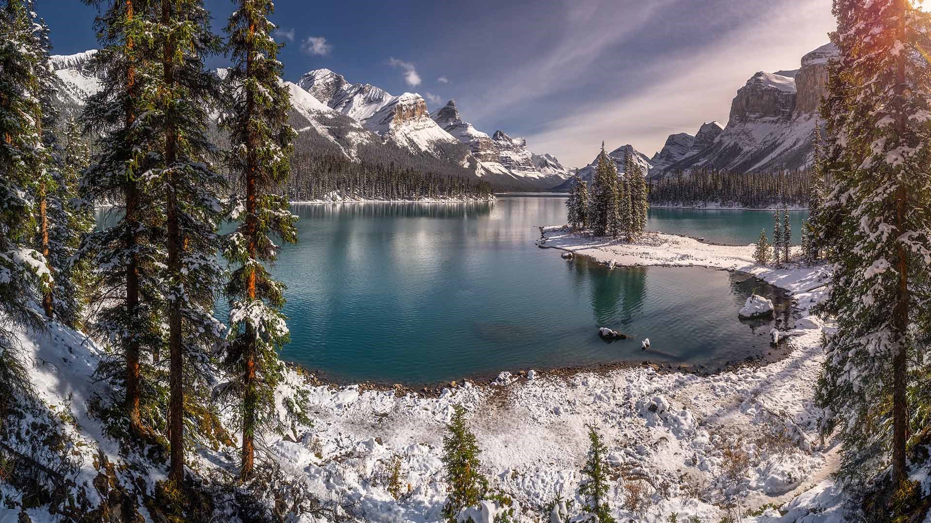 Snowy landscape with a lake and mountains HD Wallpaper