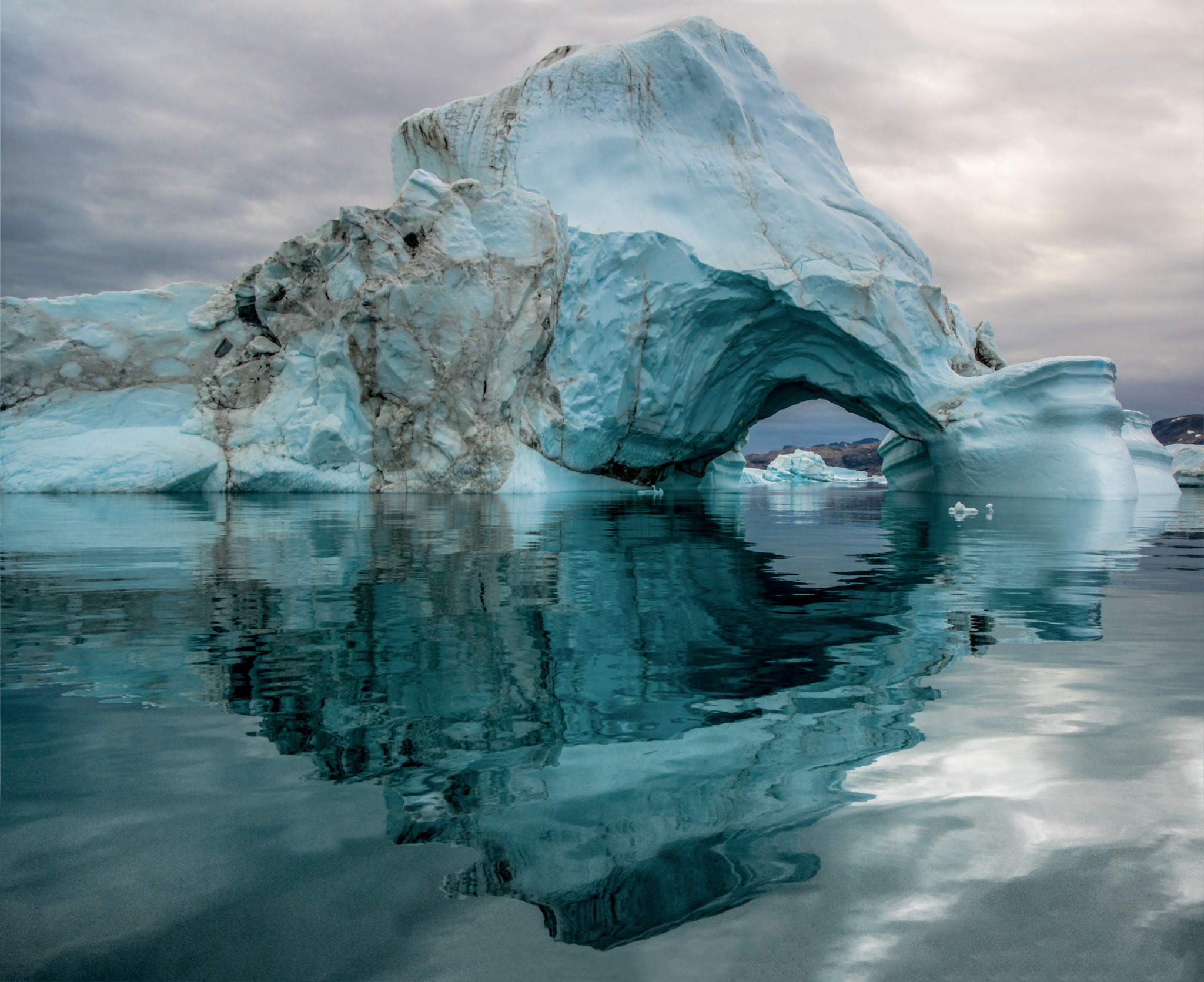 Iceberg with an arch in the Arctic ocean HD Wallpaper