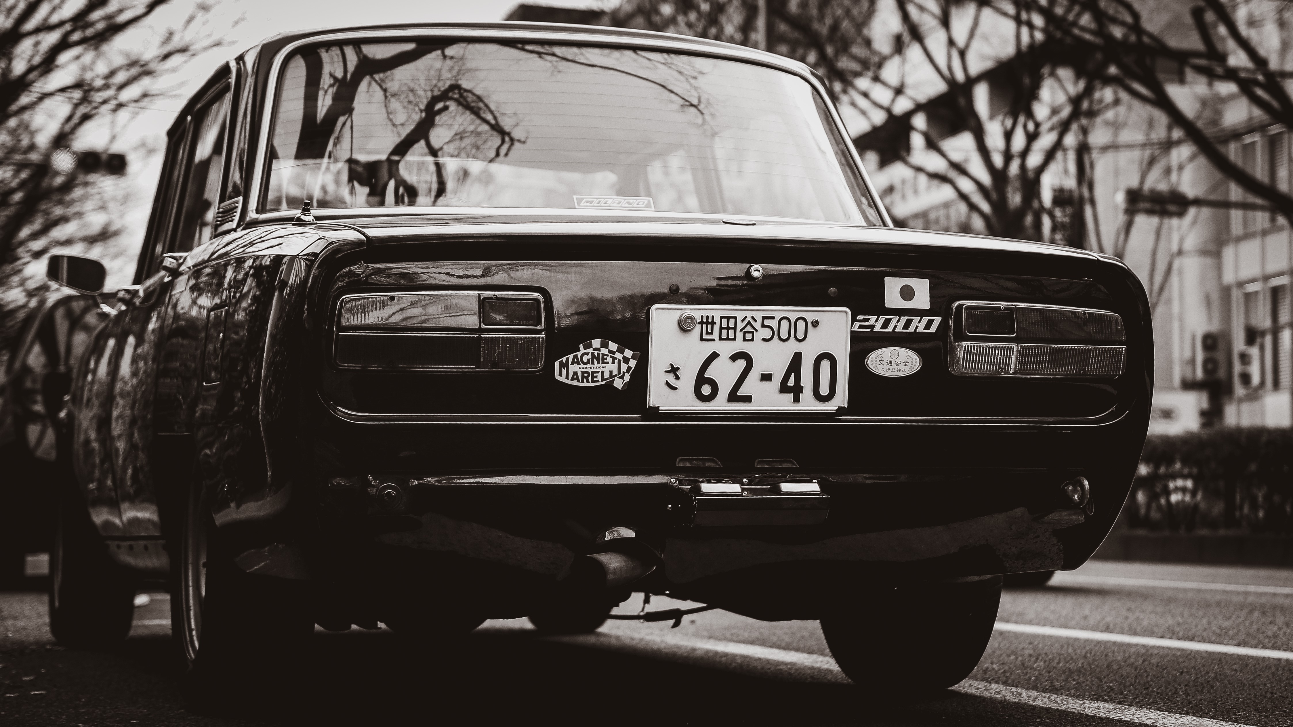 Monochrome rear view of a classic Japanese car HD Wallpaper