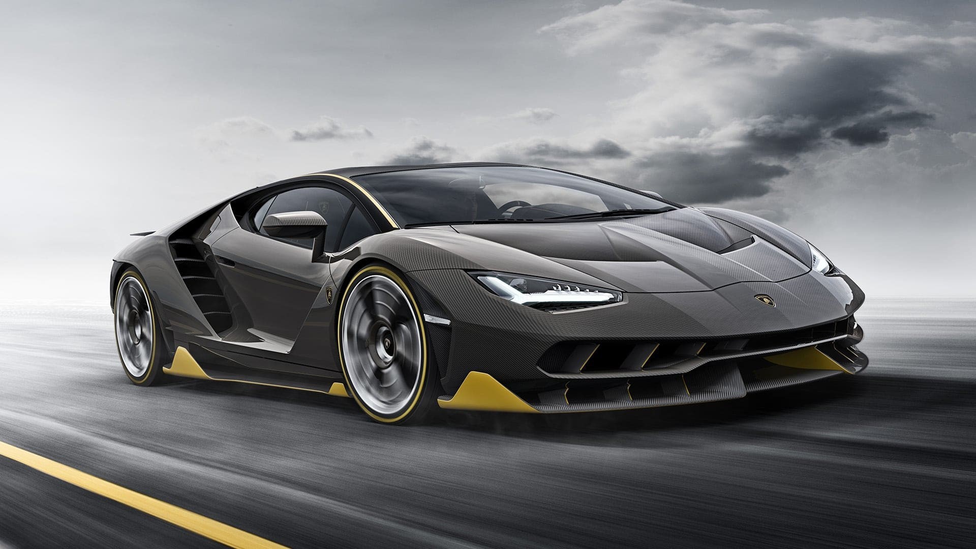Lamborghini Centenario driving on a road HD Wallpaper