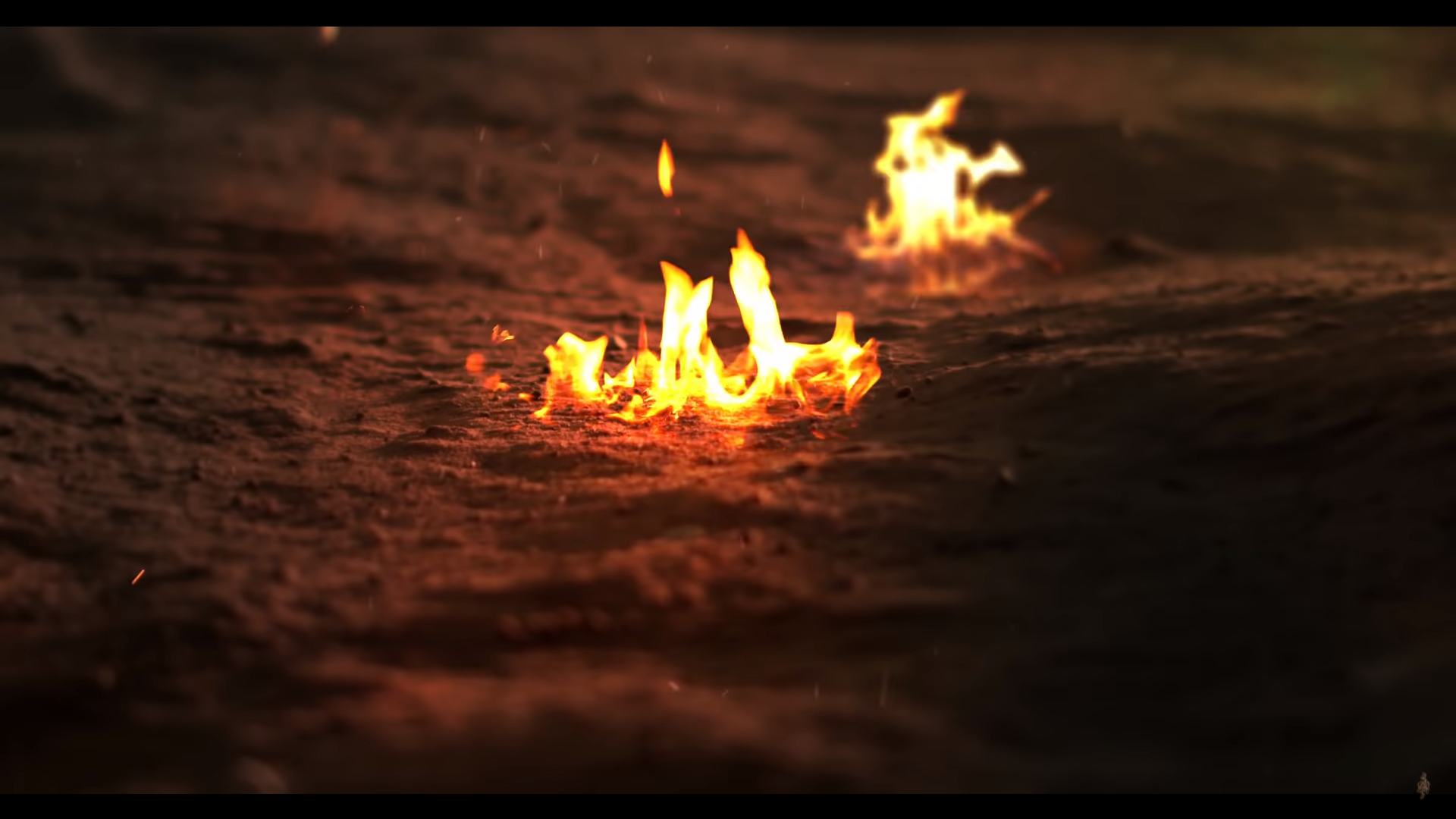 Fire burning on the ground with depth of field HD Wallpaper