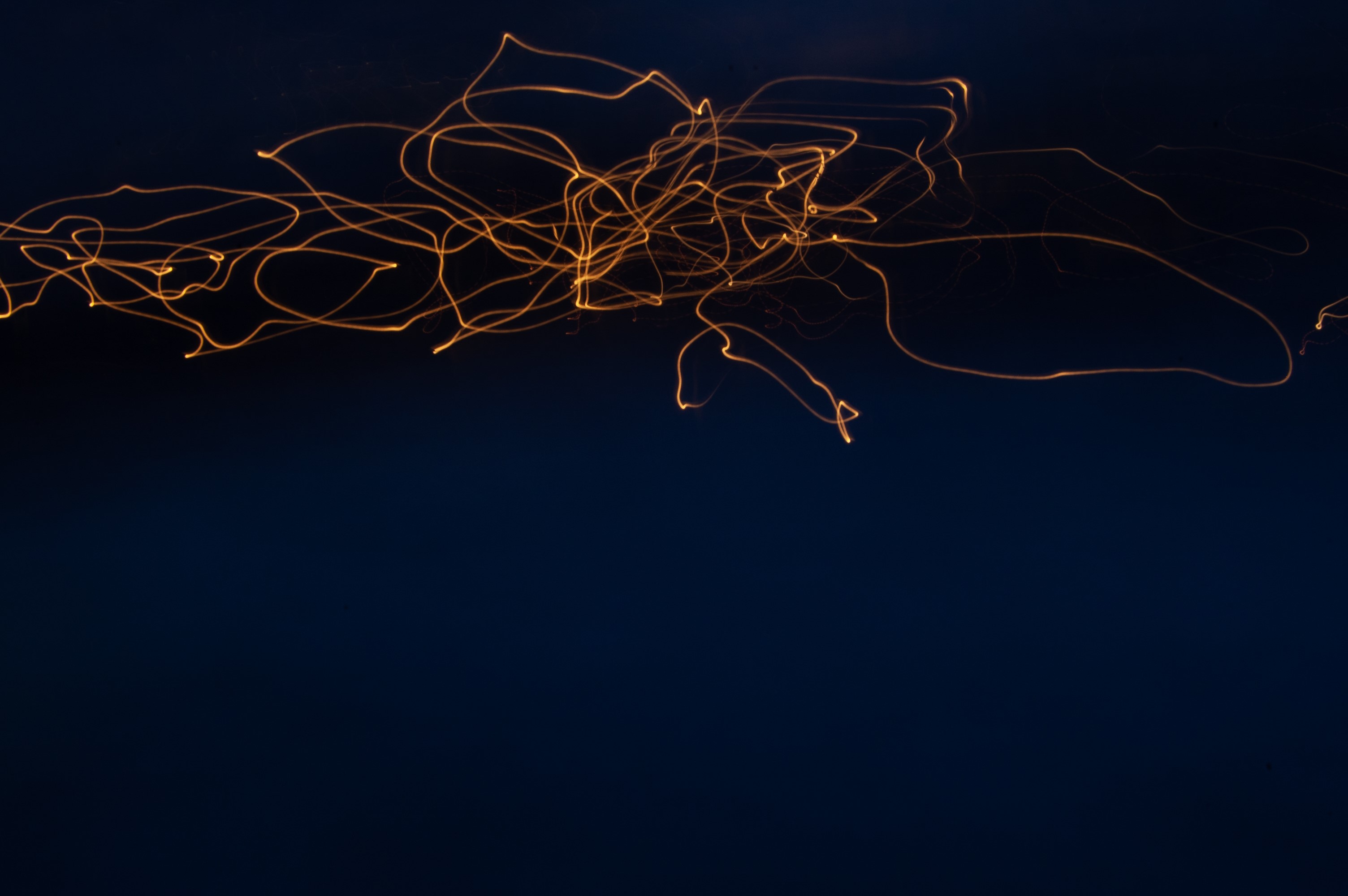 Abstract light trails on dark background HD Wallpaper