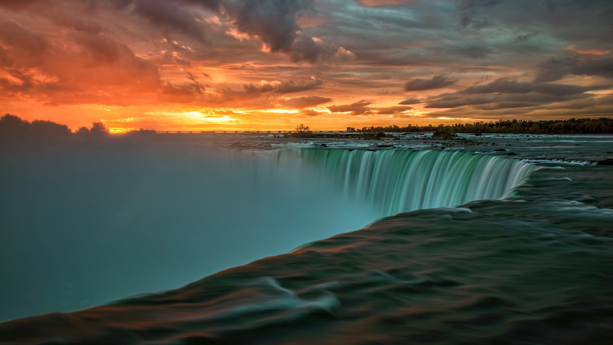 Niagara Falls at sunset with dramatic clouds HD Wallpaper