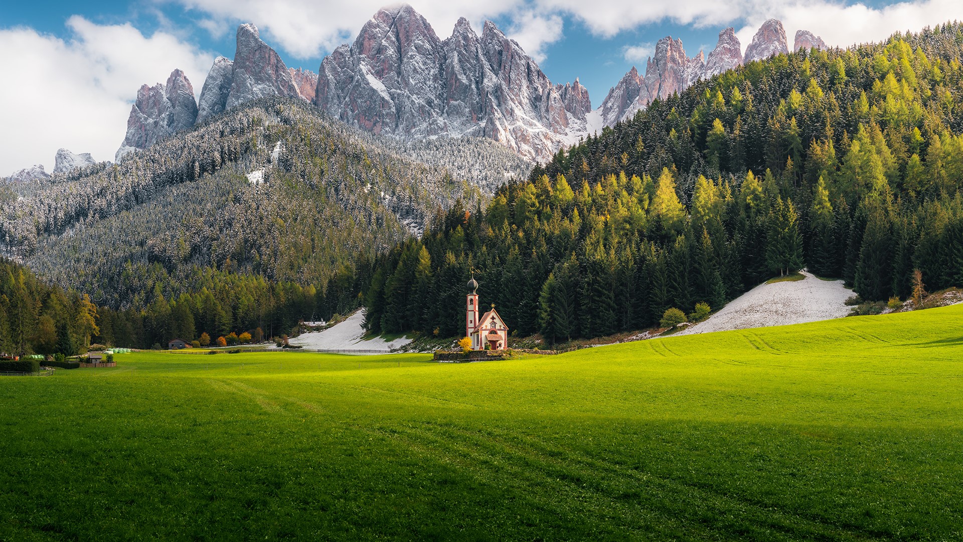 Church in a green field with snowy mountains HD Wallpaper