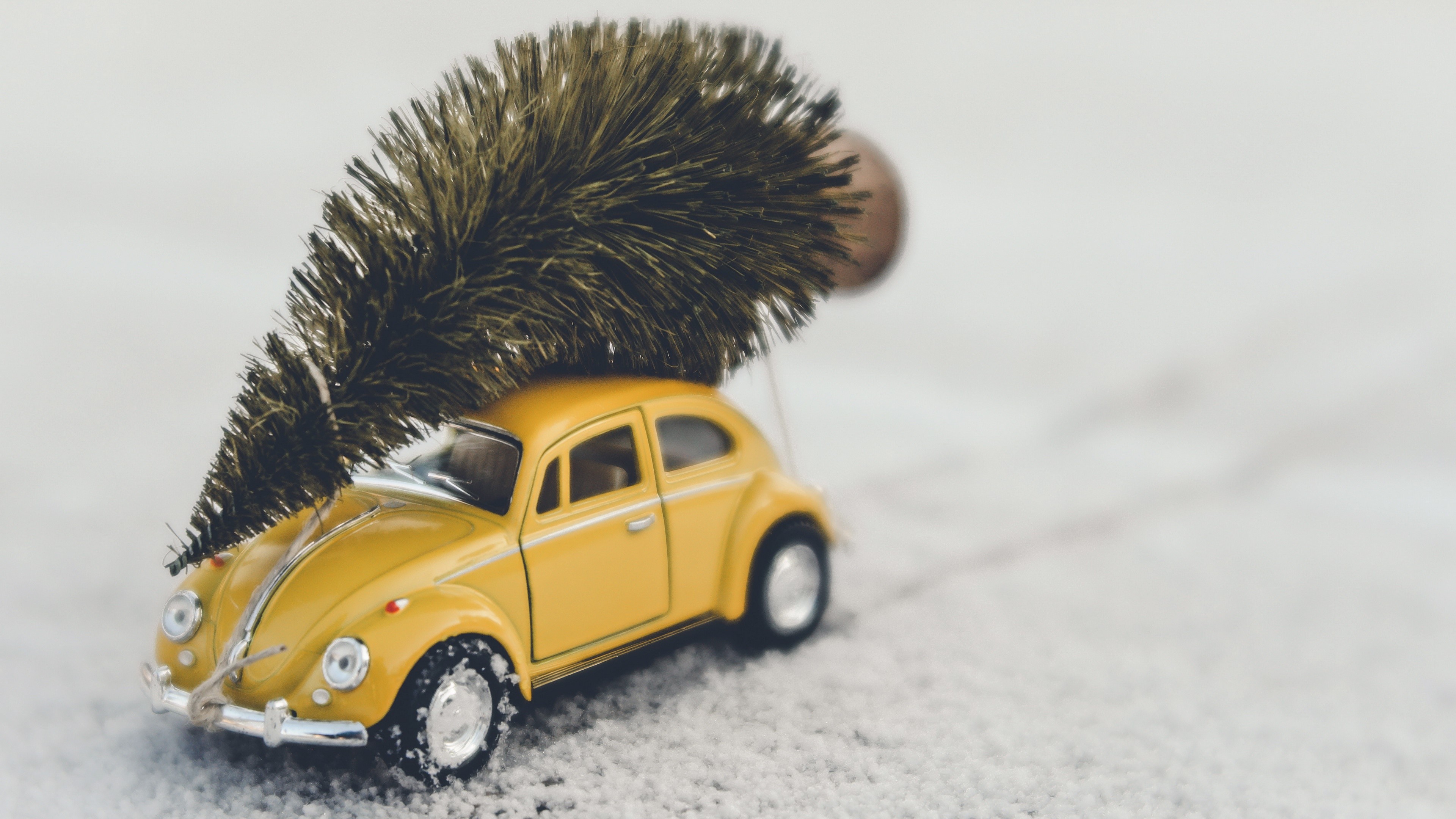 Yellow Volkswagen Beetle toy car with Christmas tree HD Wallpaper