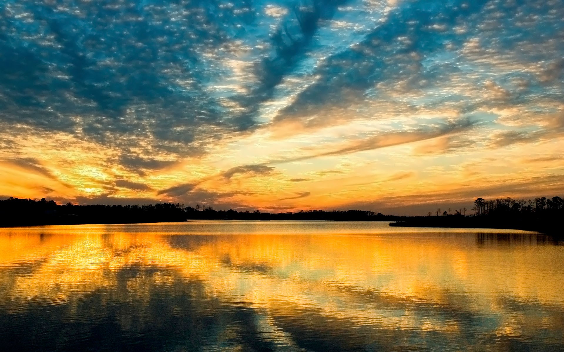 Sunset over a calm lake with colorful clouds HD Wallpaper