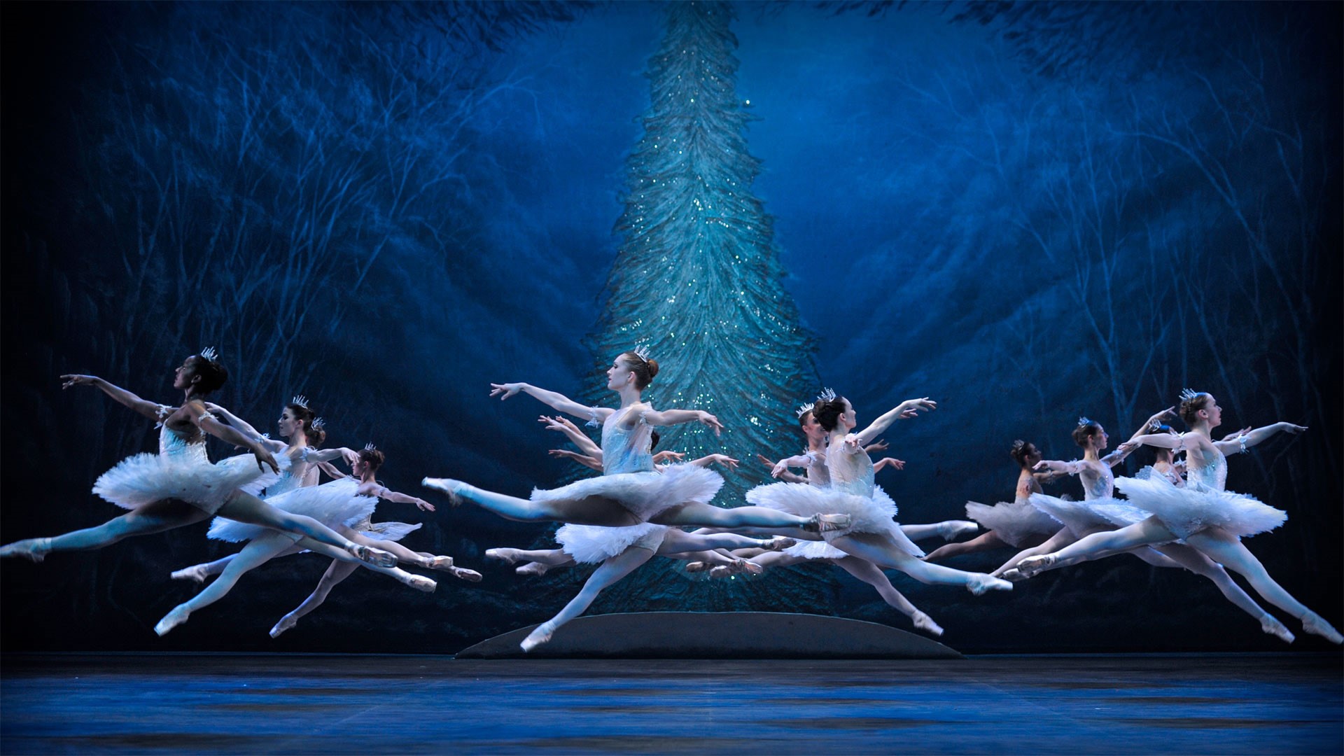 Ballet dancers in white tutus performing on stage HD Wallpaper
