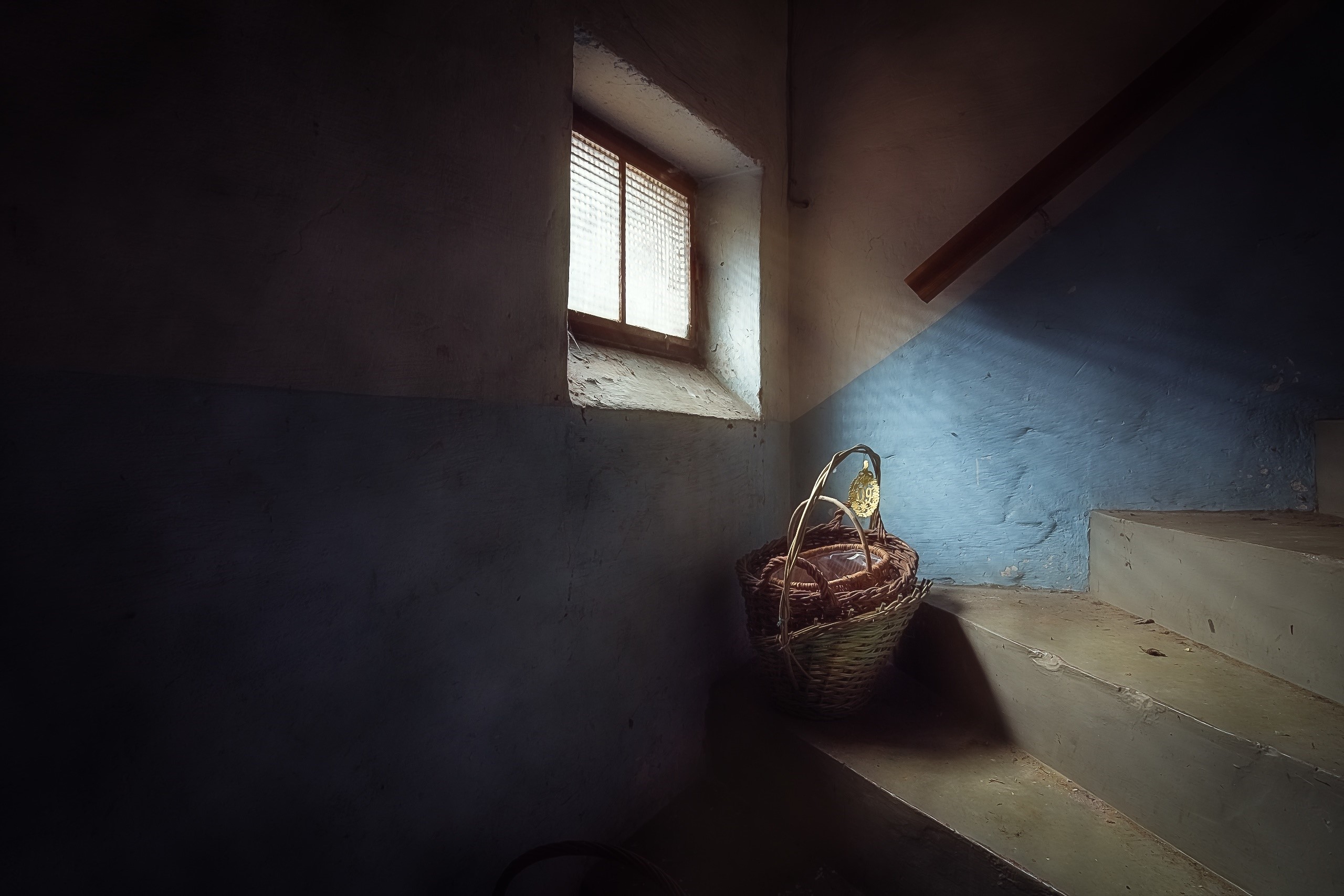 Basket on stairs near window HD Wallpaper