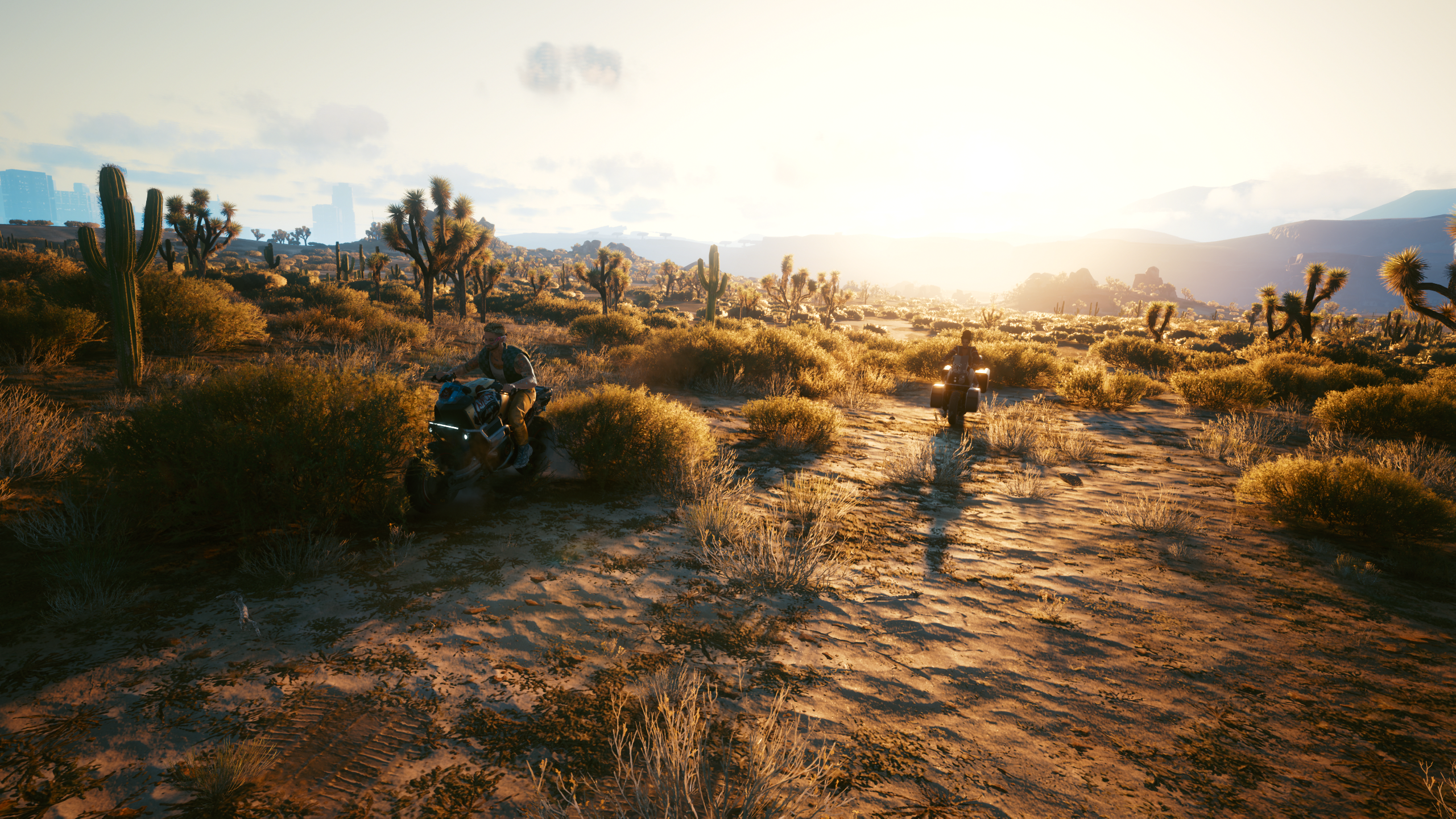Cyberpunk 2077 screenshot of two people on motorcycles in a desert HD Wallpaper