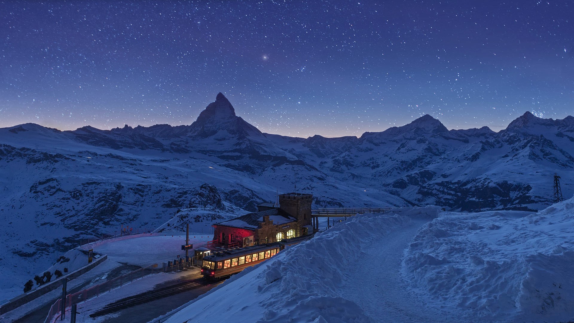 Matterhorn mountain and train station at night in winter HD Wallpaper