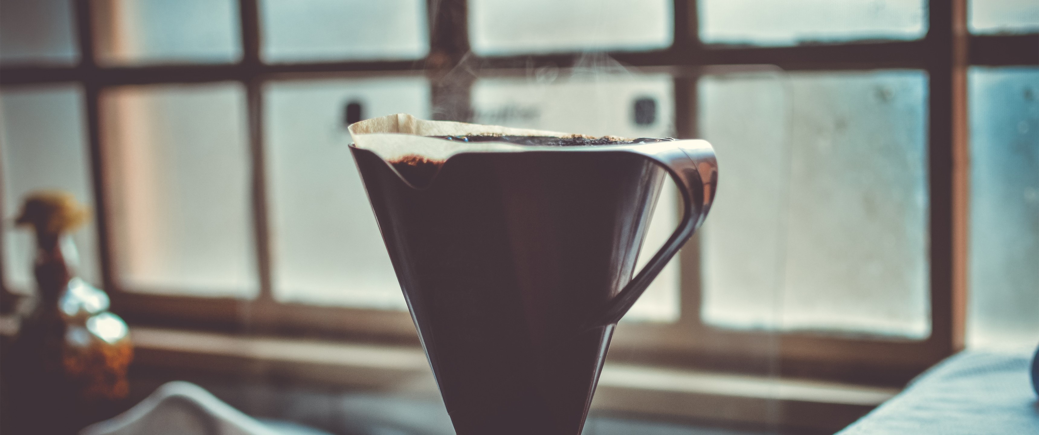 Coffee brewing in a filter cone HD Wallpaper