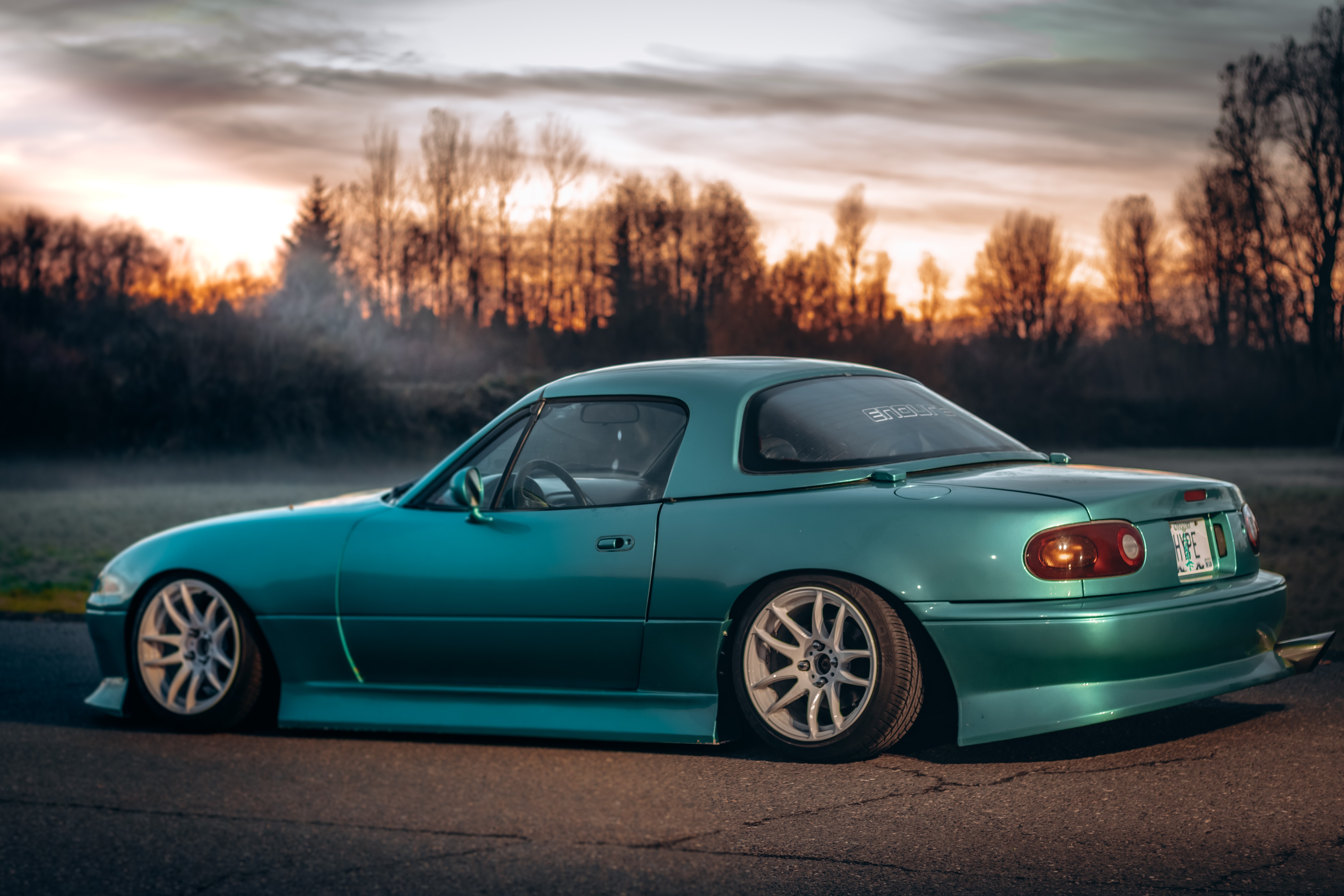 4K lowered teal Mazda MX-5 Miata at sunset HD Wallpaper