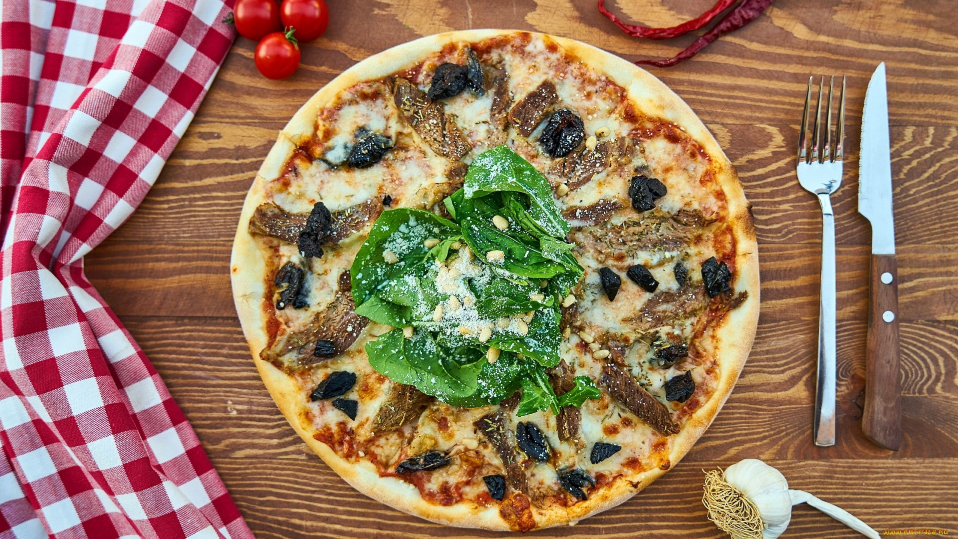 Pizza with spinach and meat on a wooden table HD Wallpaper