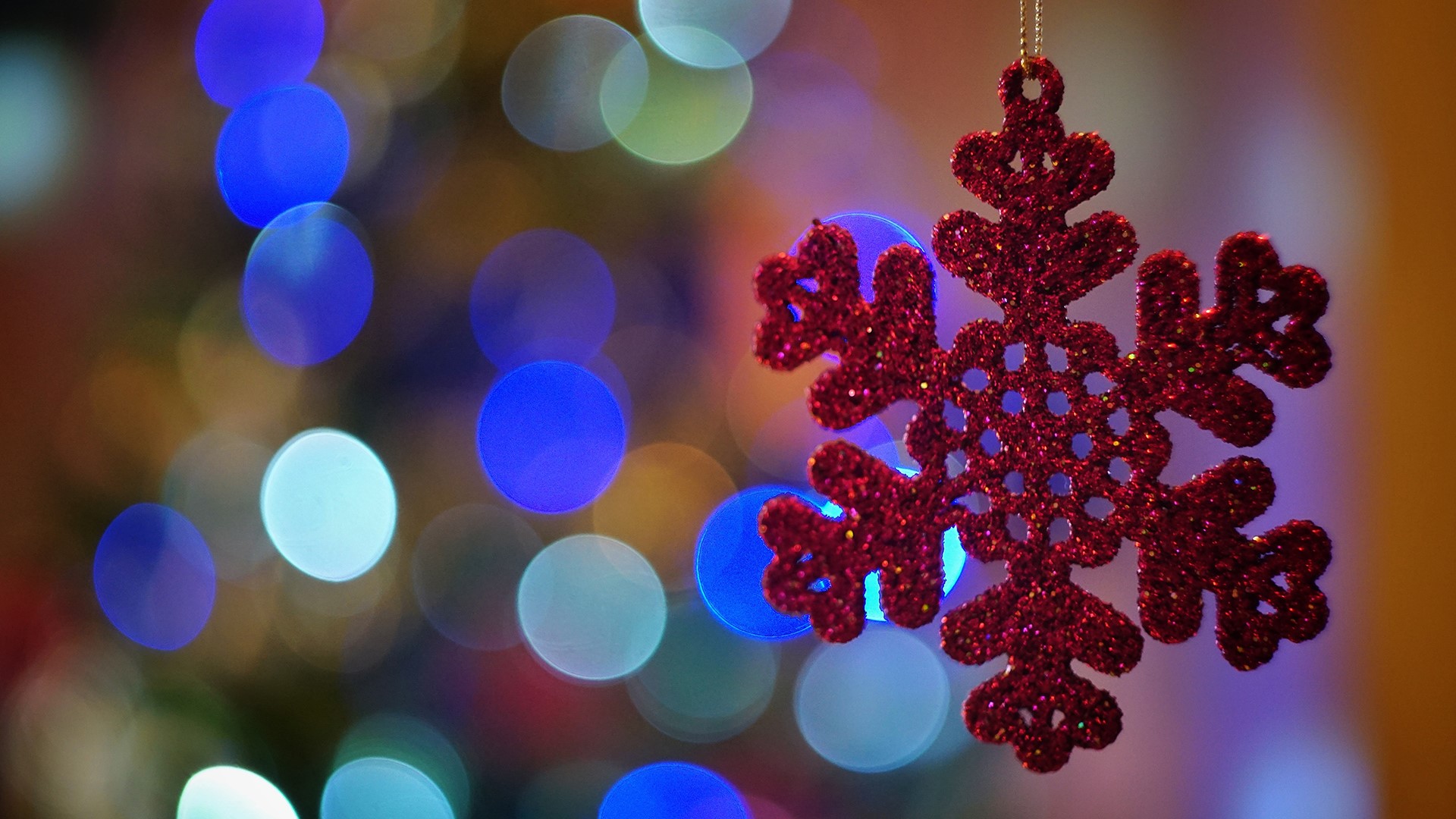 Red glitter snowflake ornament with Christmas lights HD Wallpaper