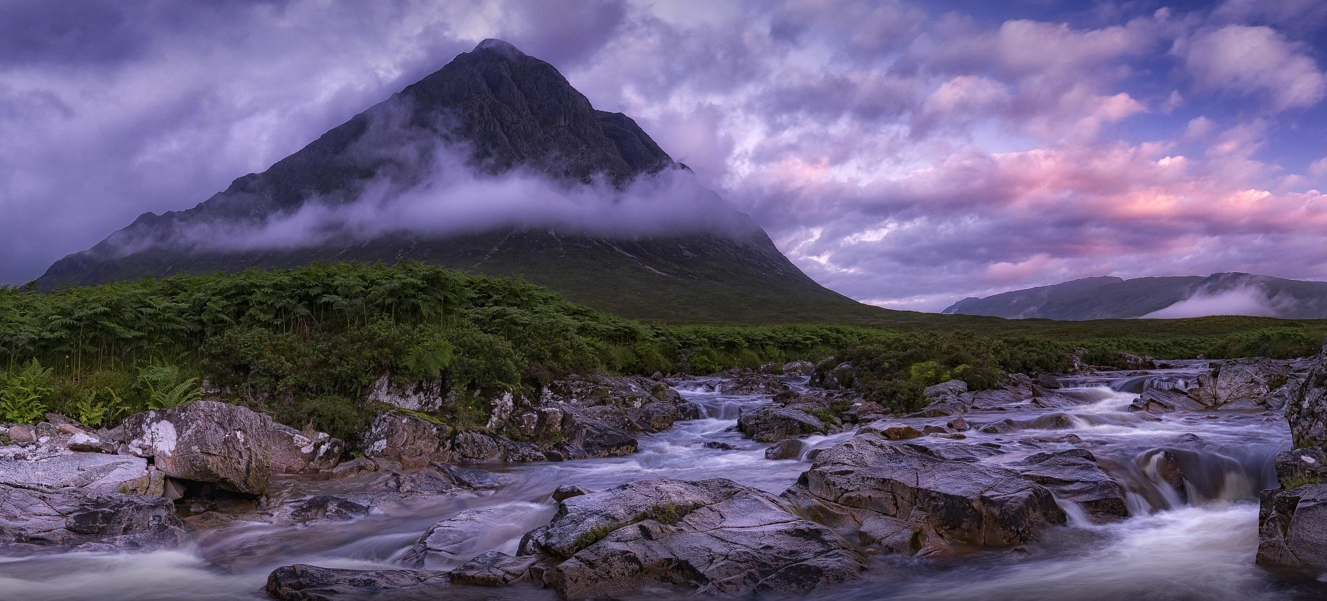 Mountain stream with purple clouds at sunset HD Wallpaper
