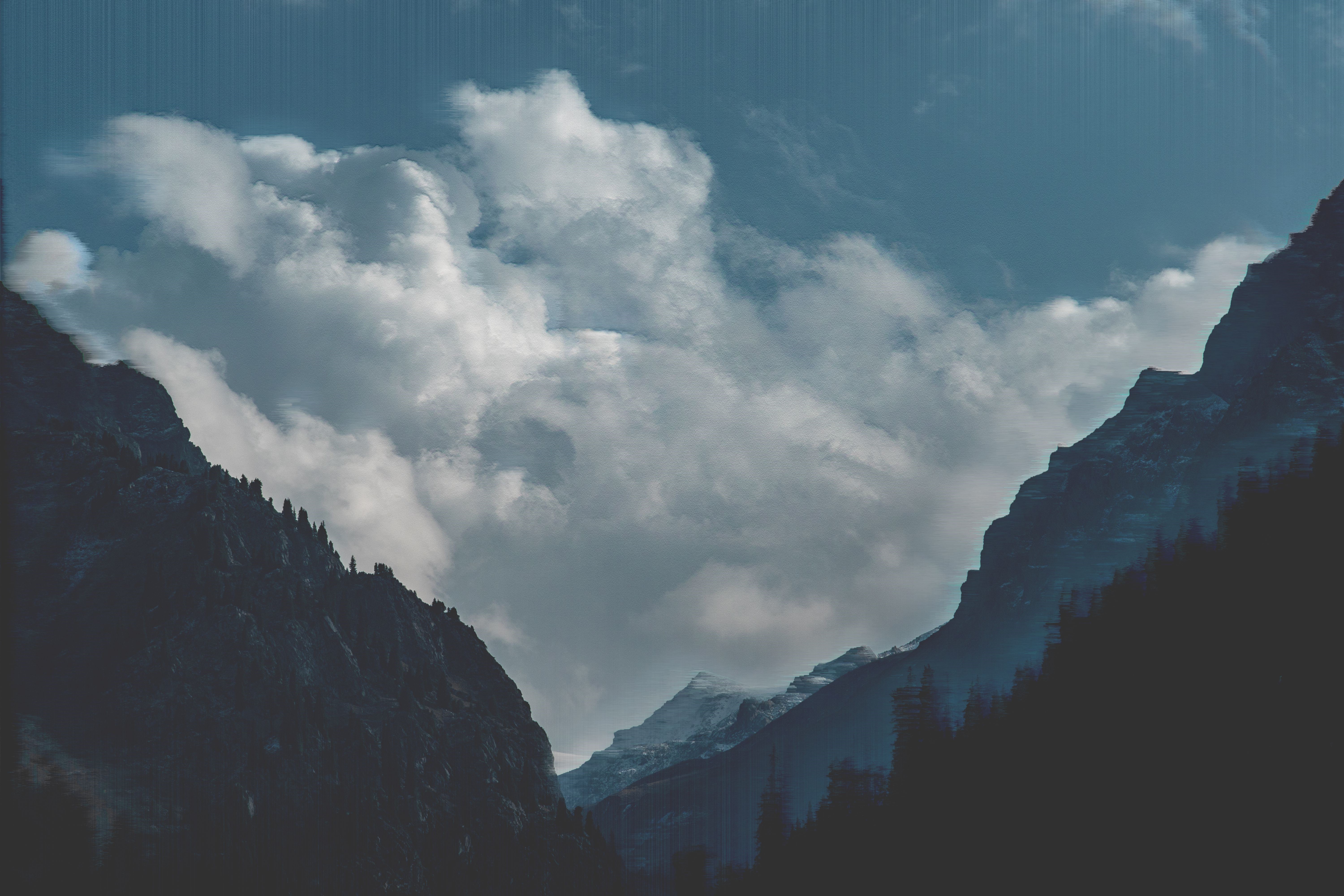 4K Teal Mountains with Glitch Art Clouds HD Wallpaper