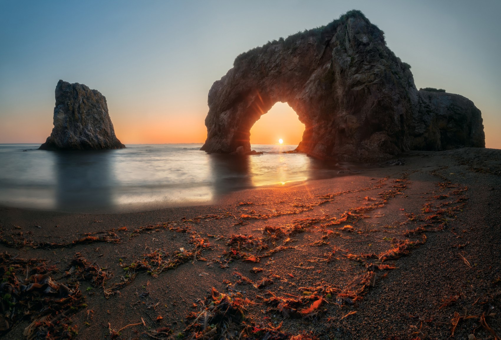 Sunset Arch Rock Formation on Beach HD Wallpaper