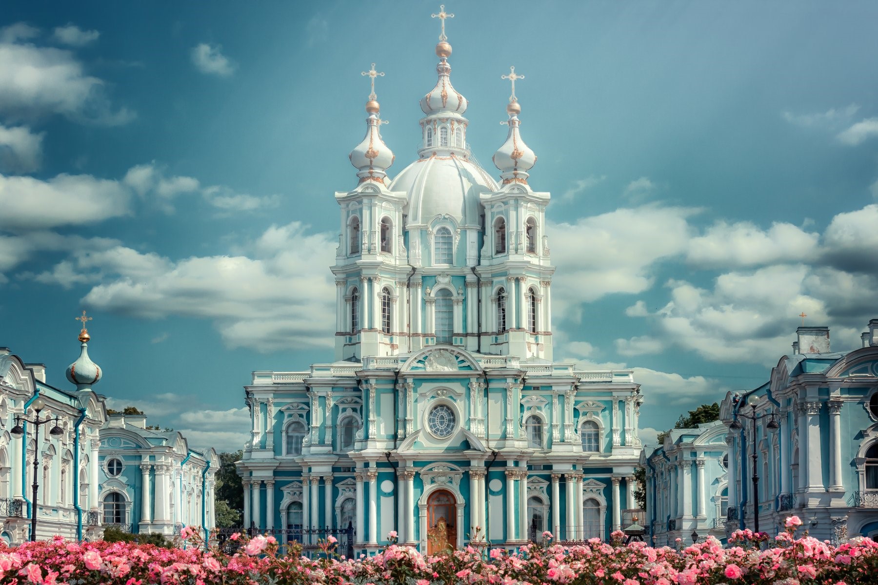 Smolny Cathedral with pink flowers in foreground HD Wallpaper