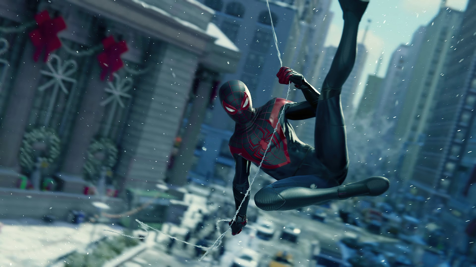 Spider-Man Miles Morales swinging through a snowy city HD Wallpaper