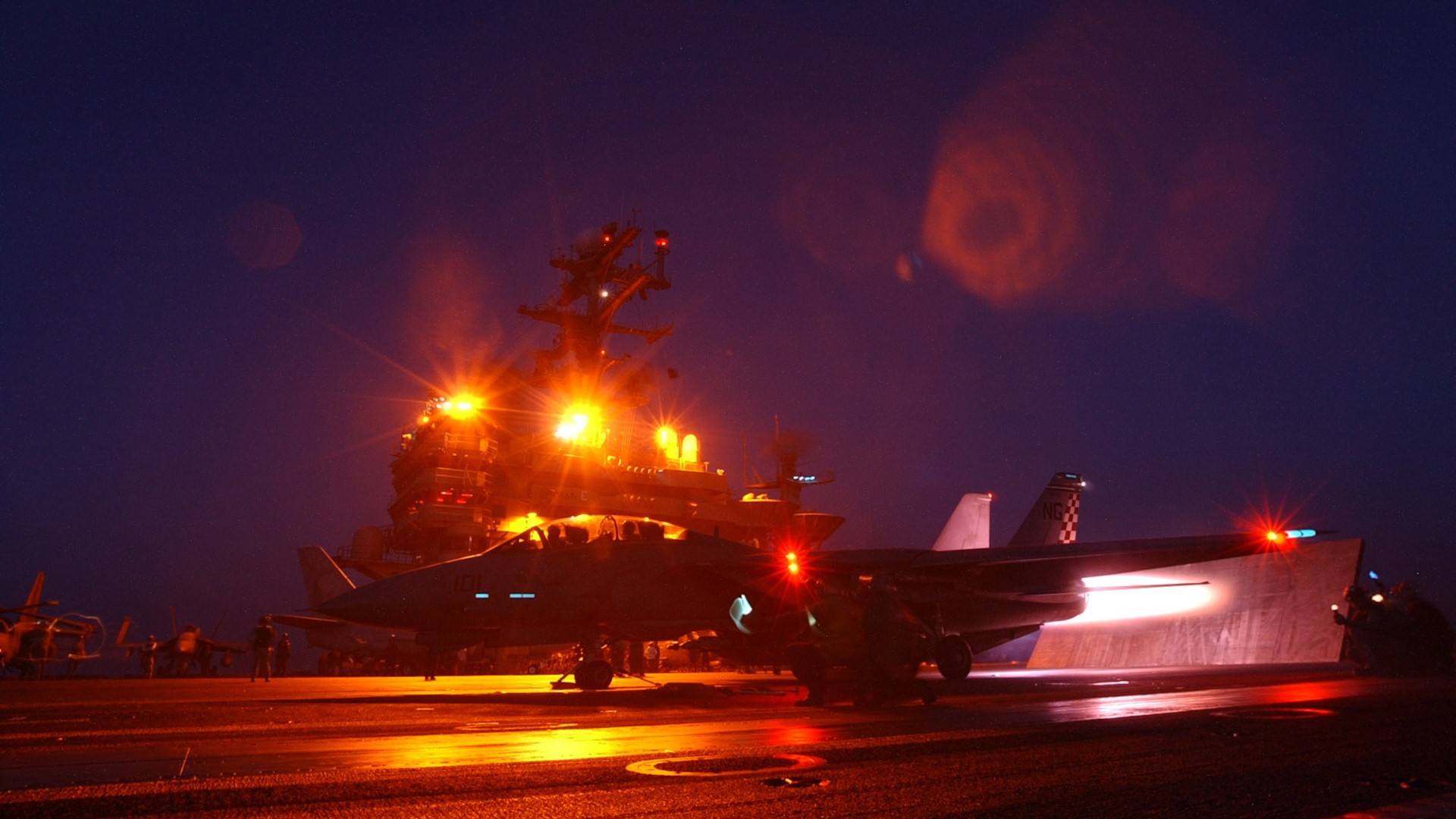 Grumman F-14 Tomcat on aircraft carrier at night HD Wallpaper