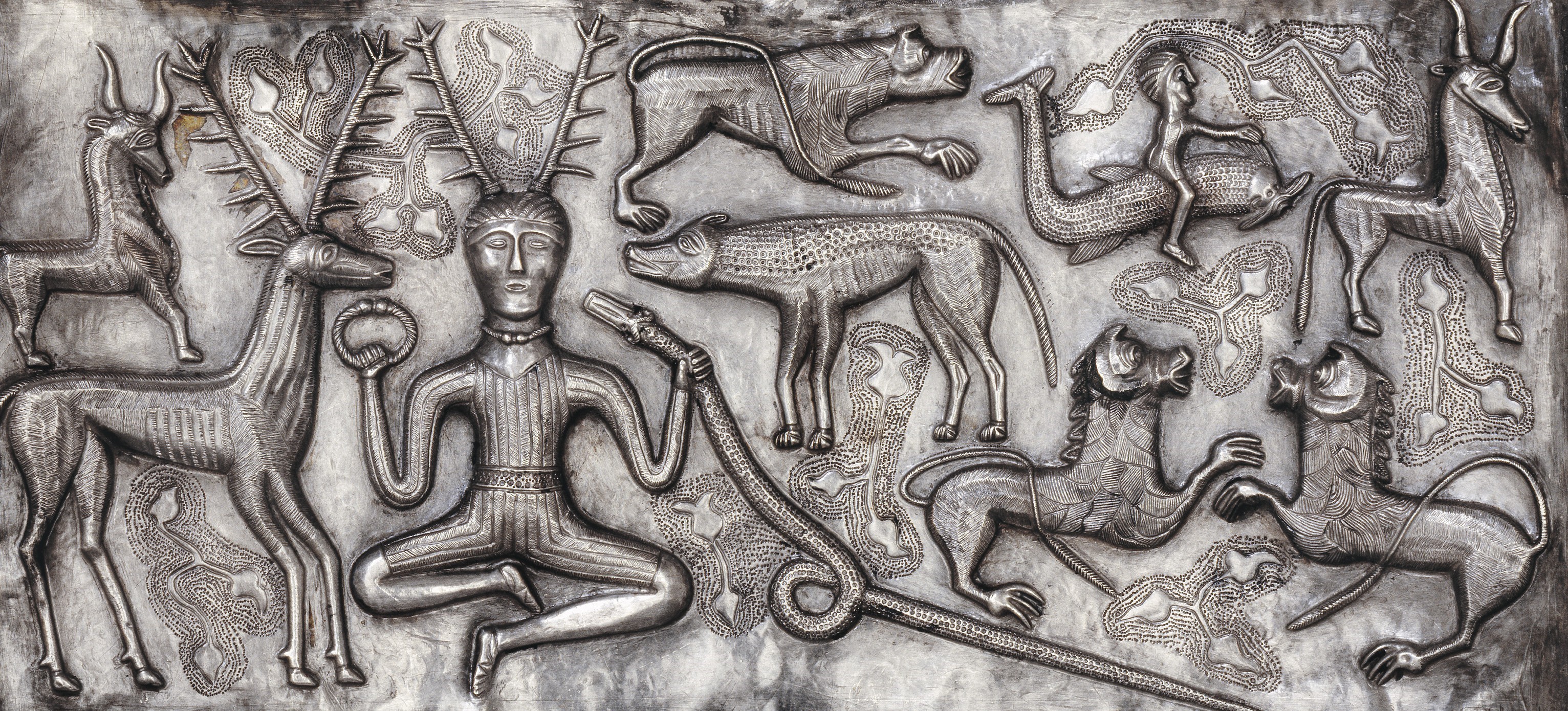 Gundestrup Cauldron panel with human figure and animals HD Wallpaper