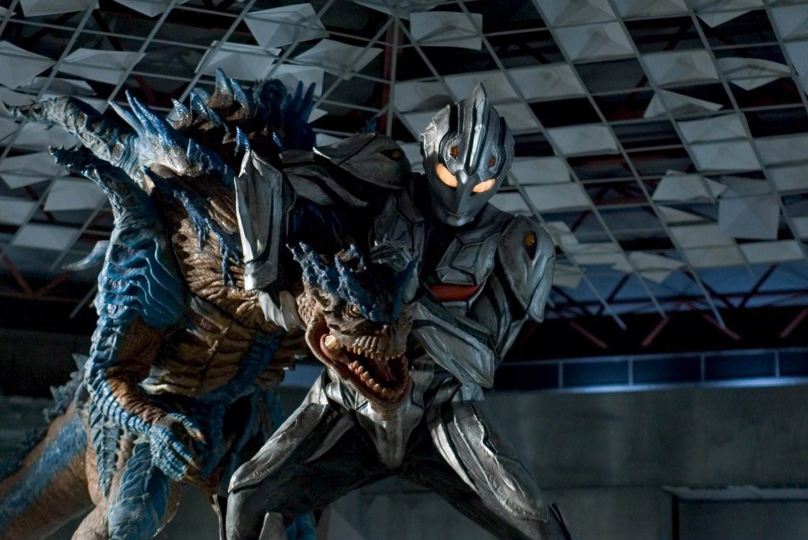 Ultraman fighting a blue monster HD Wallpaper