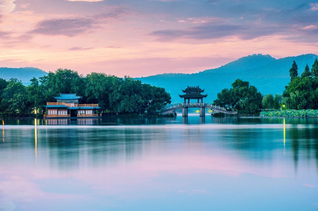 Pagoda bridge and building on a lake at sunset HD Wallpaper