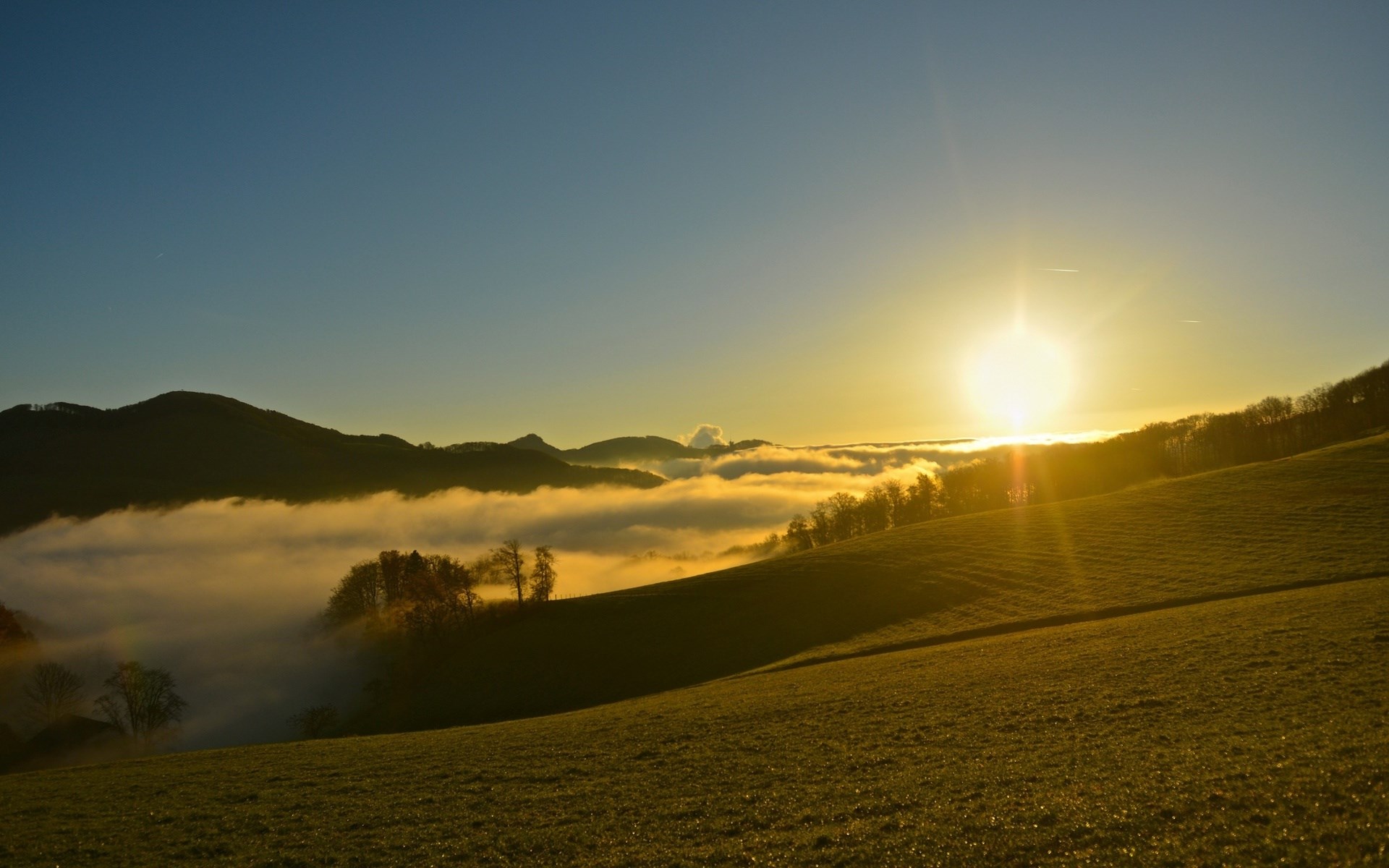Sunrise over foggy mountains and rolling hills HD Wallpaper