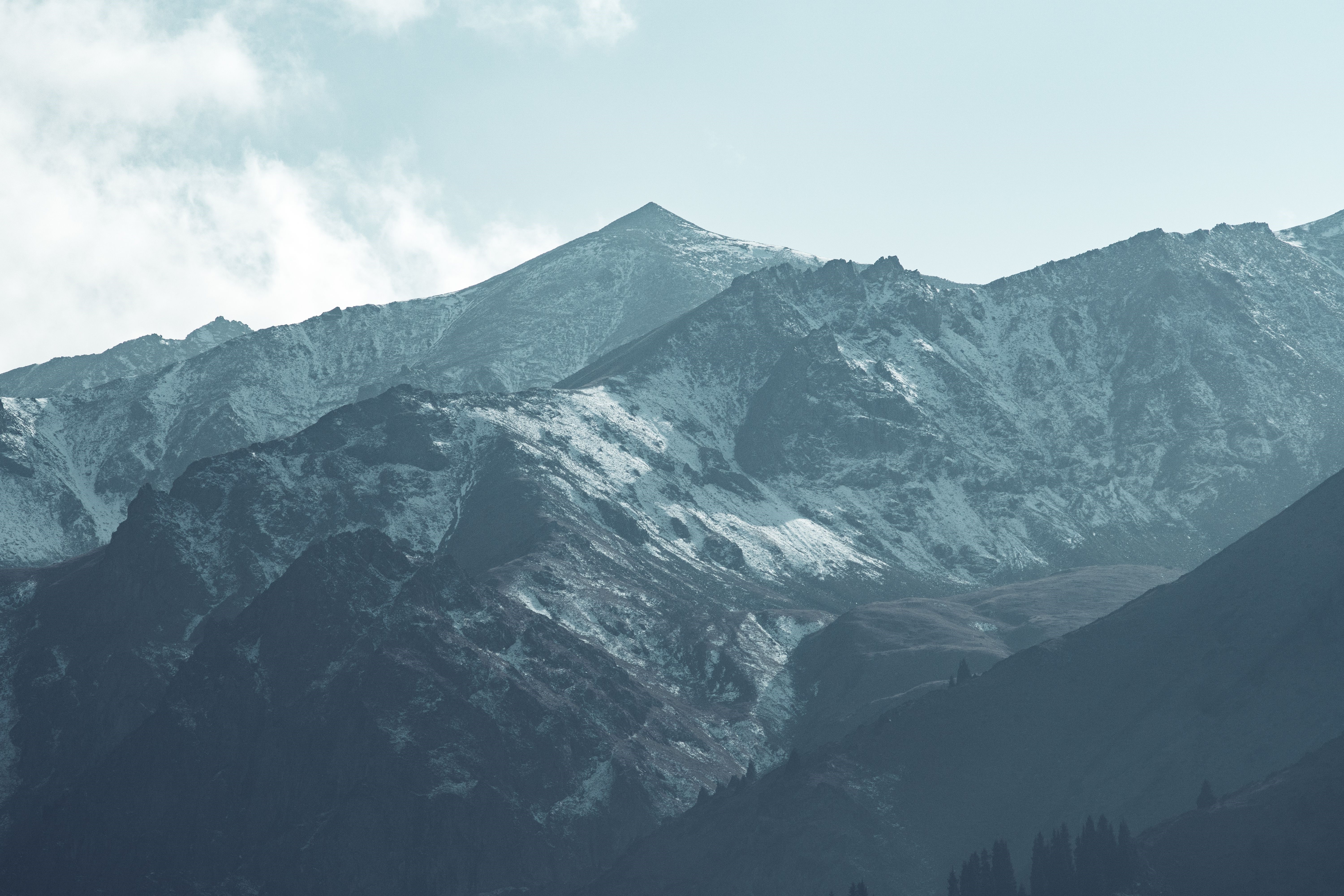 Snowy mountains with mist and forest HD Wallpaper