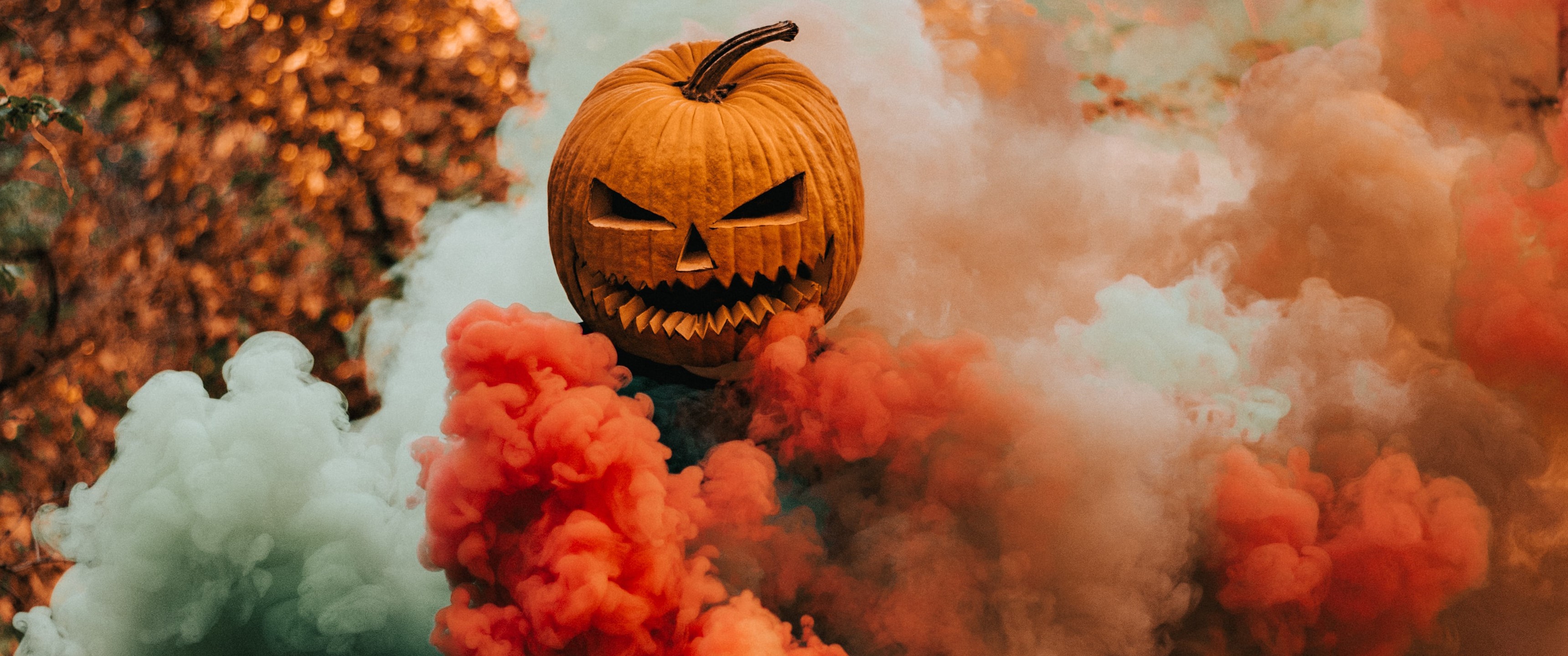 Jack-o'-lantern with orange and white smoke HD Wallpaper