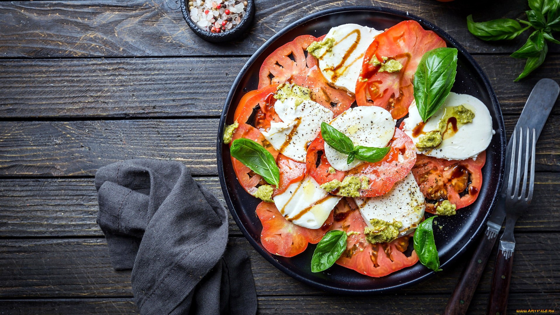 Caprese salad with tomatoes and mozzarella on a plate HD Wallpaper