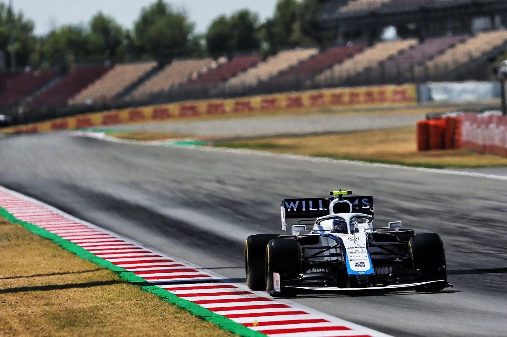 Williams Racing Formula 1 car on a race track HD Wallpaper