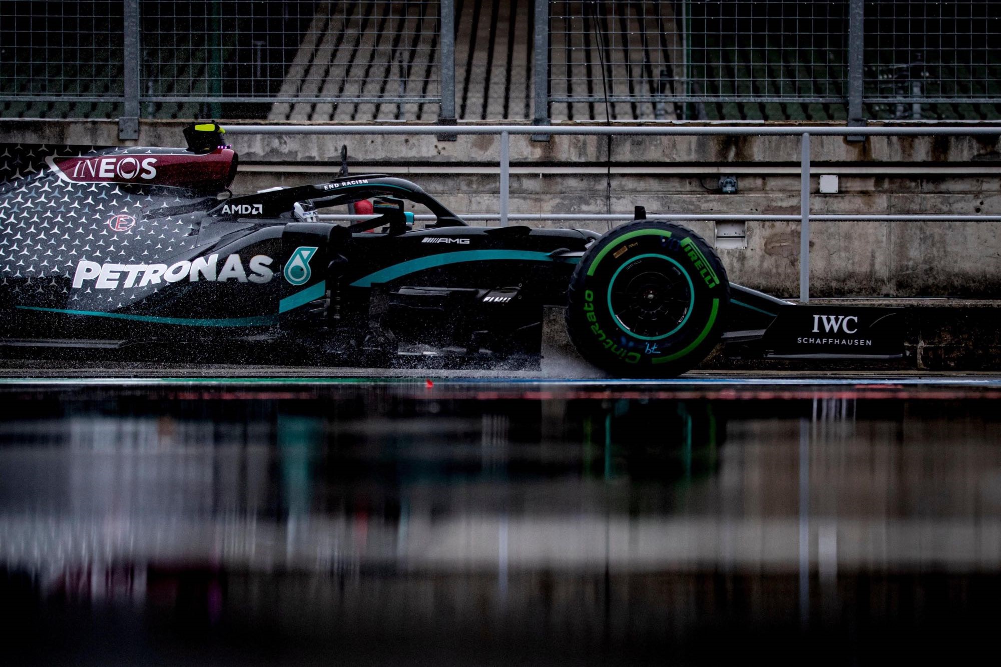 Mercedes AMG Petronas F1 car on wet track HD Wallpaper