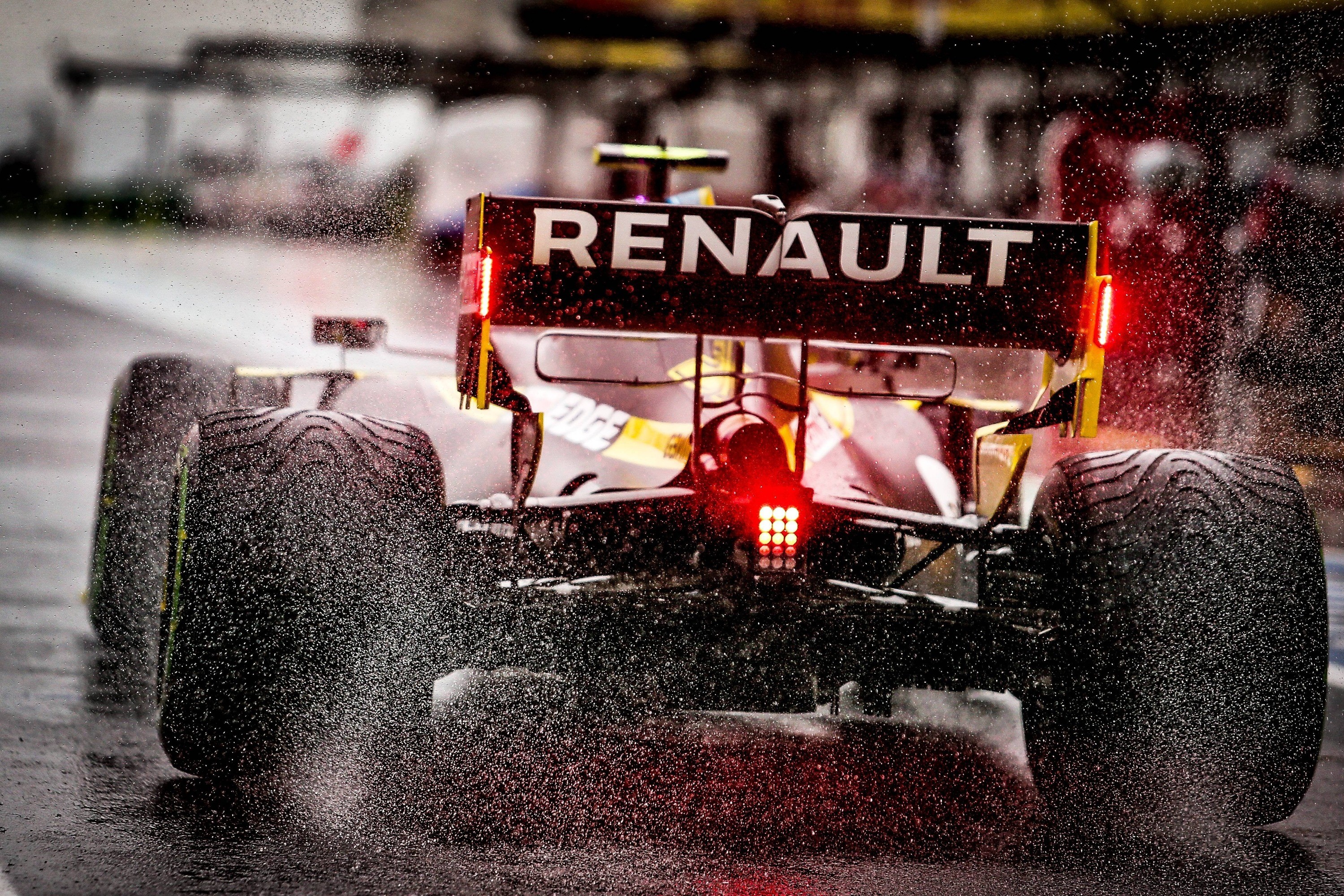 Renault Formula 1 car driving in the rain HD Wallpaper