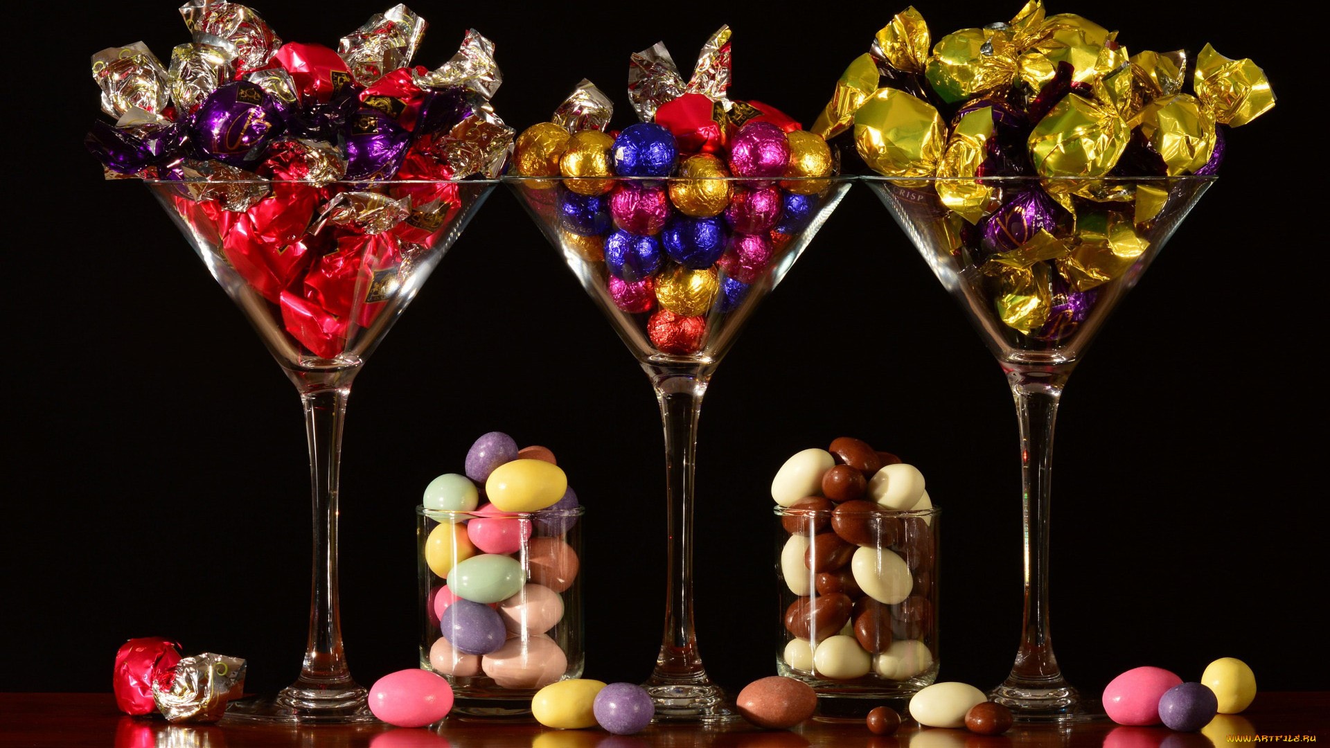 Assortment of chocolates and candies in martini glasses HD Wallpaper