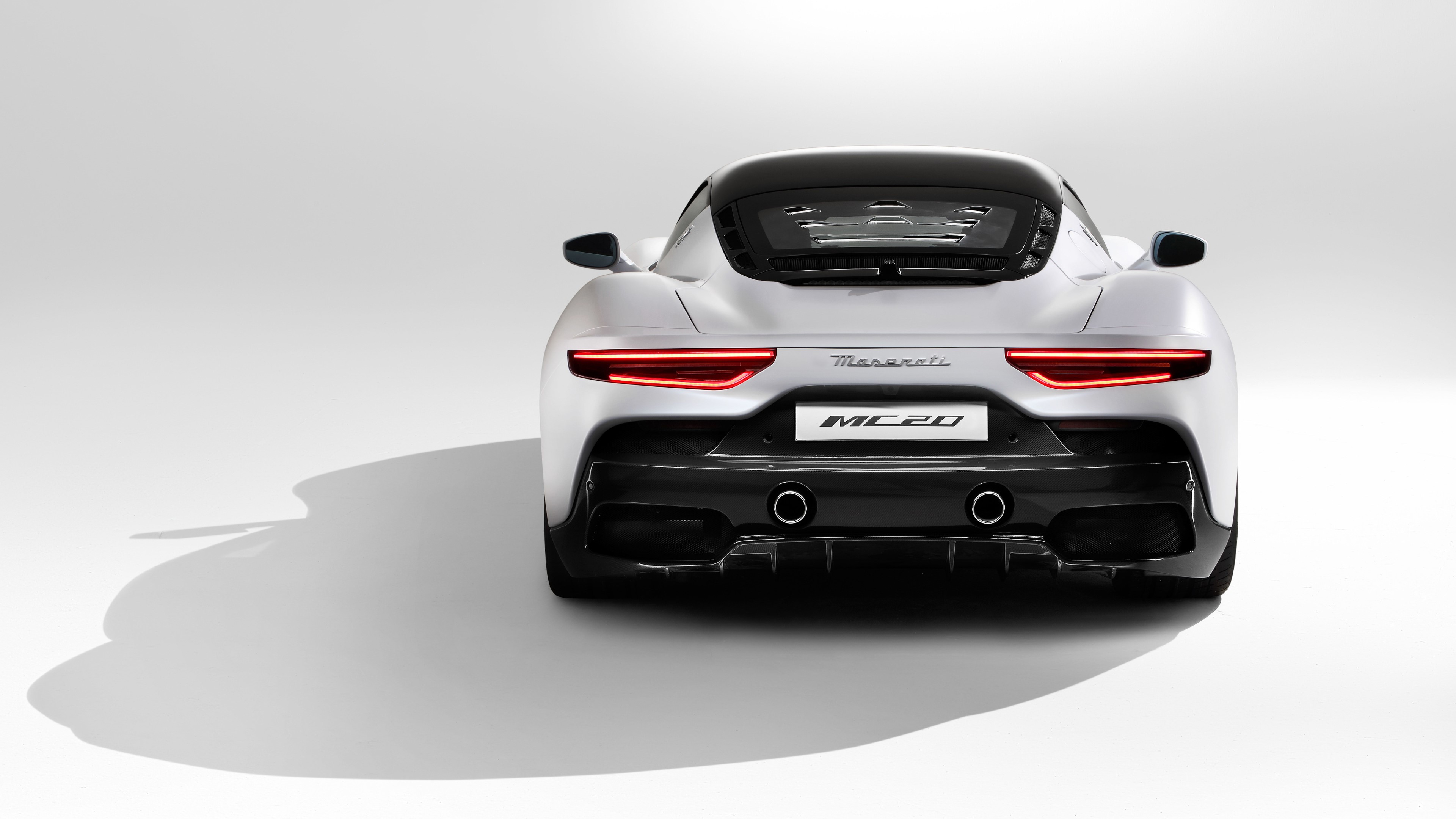 Maserati MC20 rear view on white background HD Wallpaper