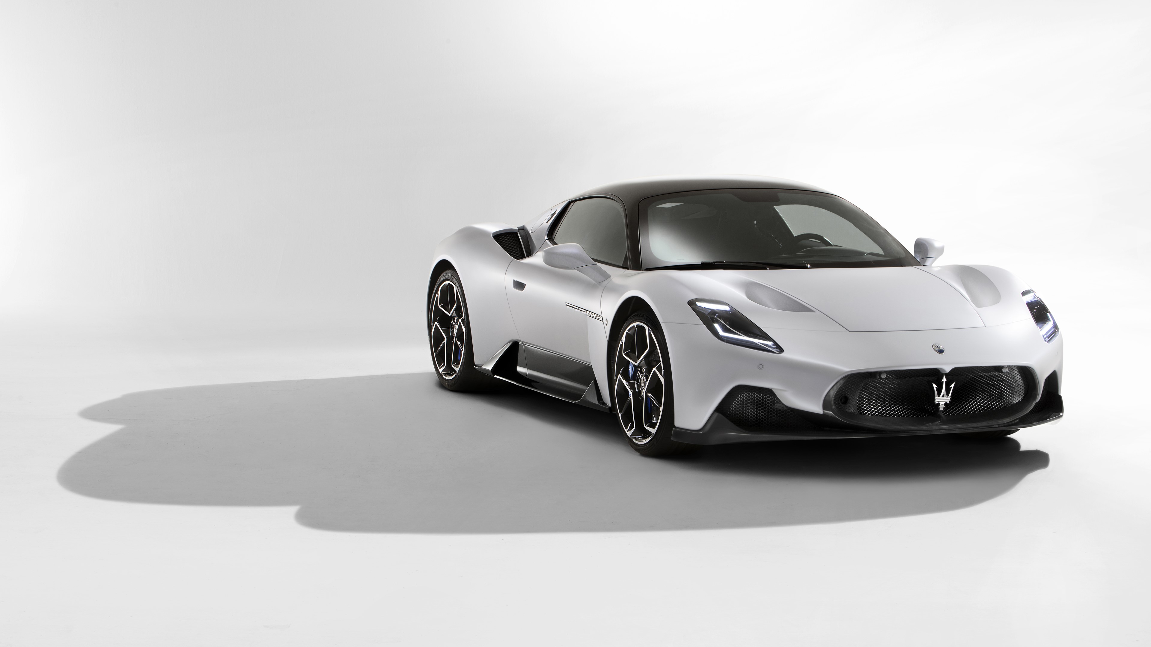 Maserati MC20 sports car on white background HD Wallpaper