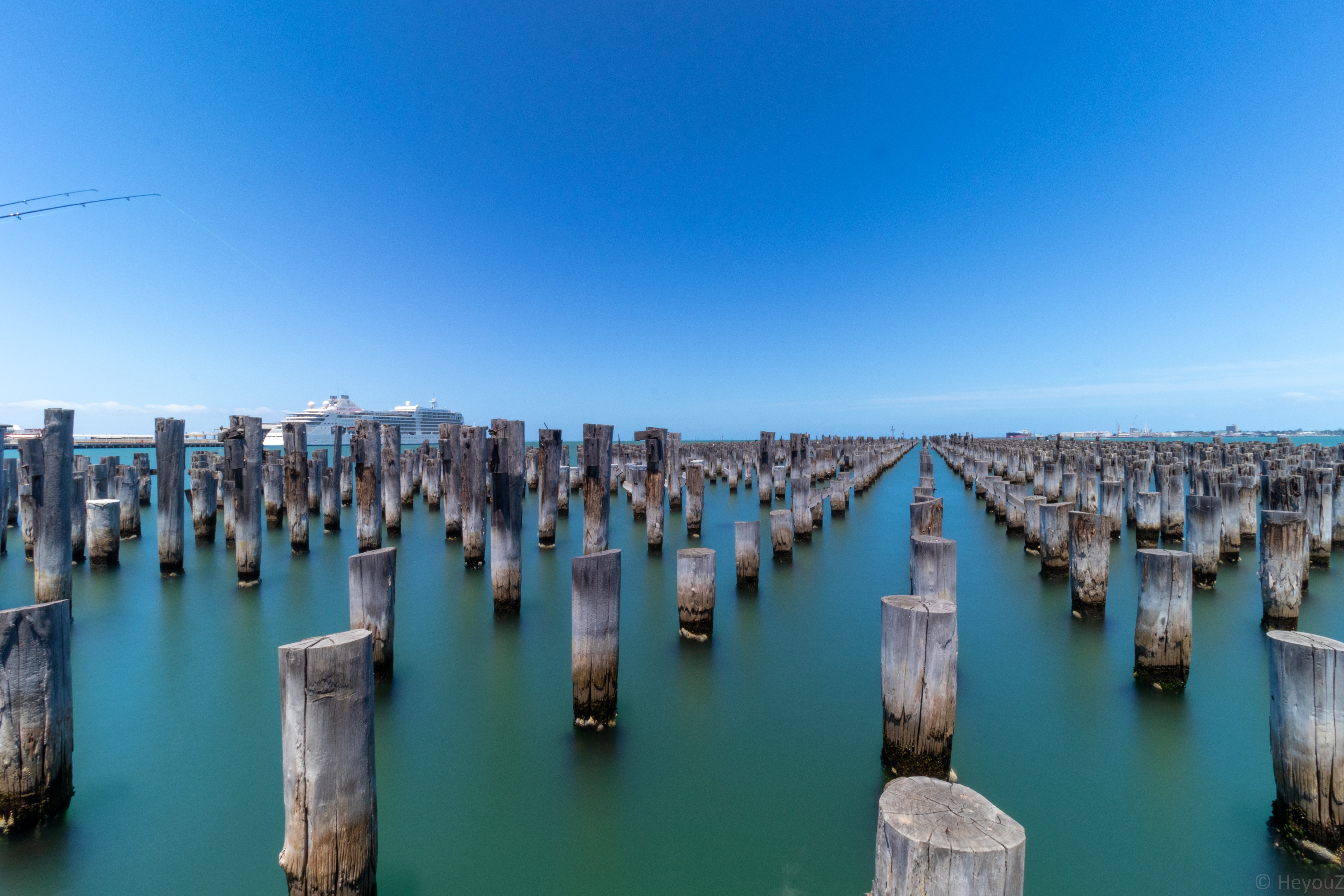 4K landscape of wooden poles in the sea HD Wallpaper