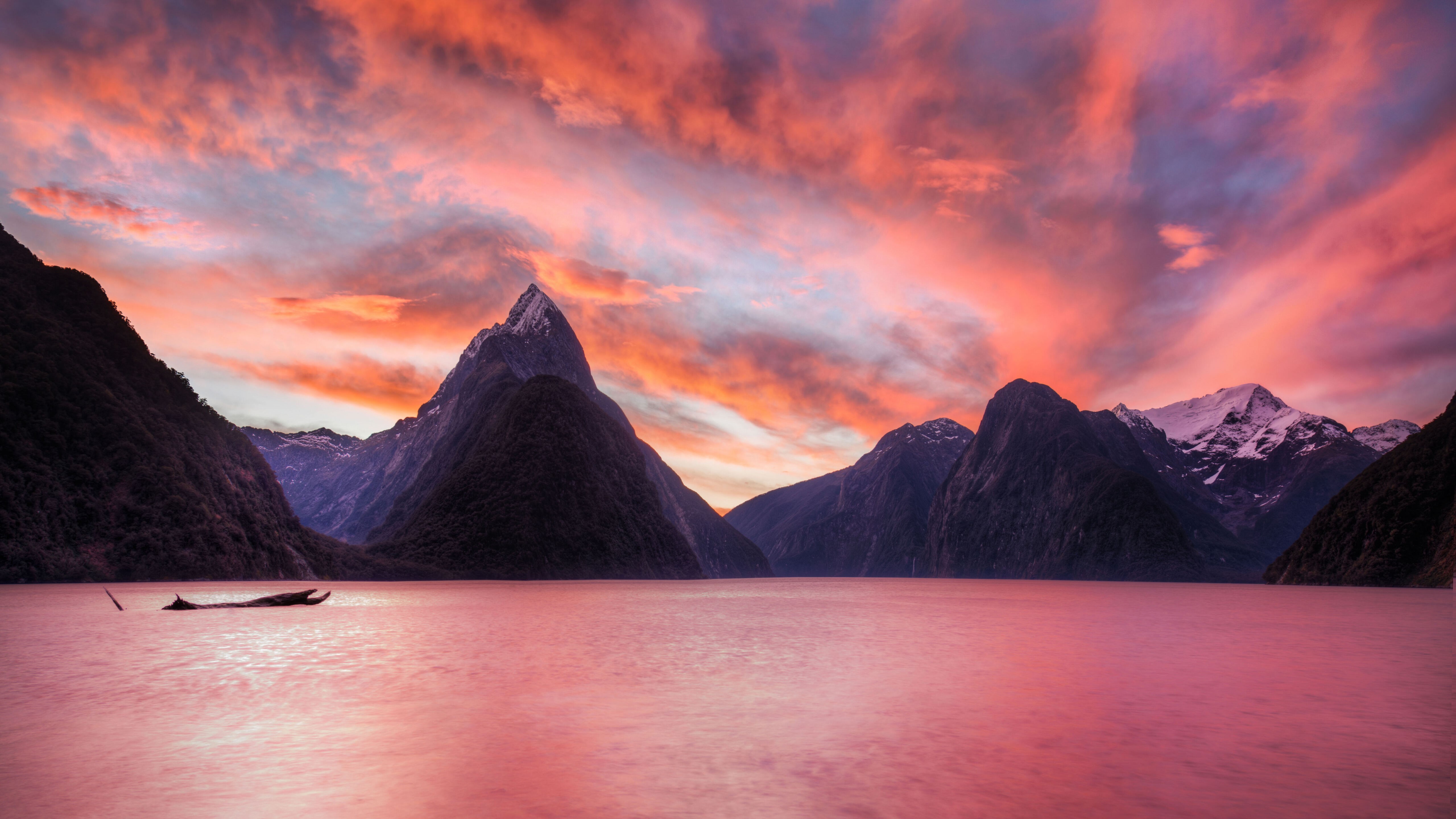 4K sunset over mountains and lake with boat HD Wallpaper